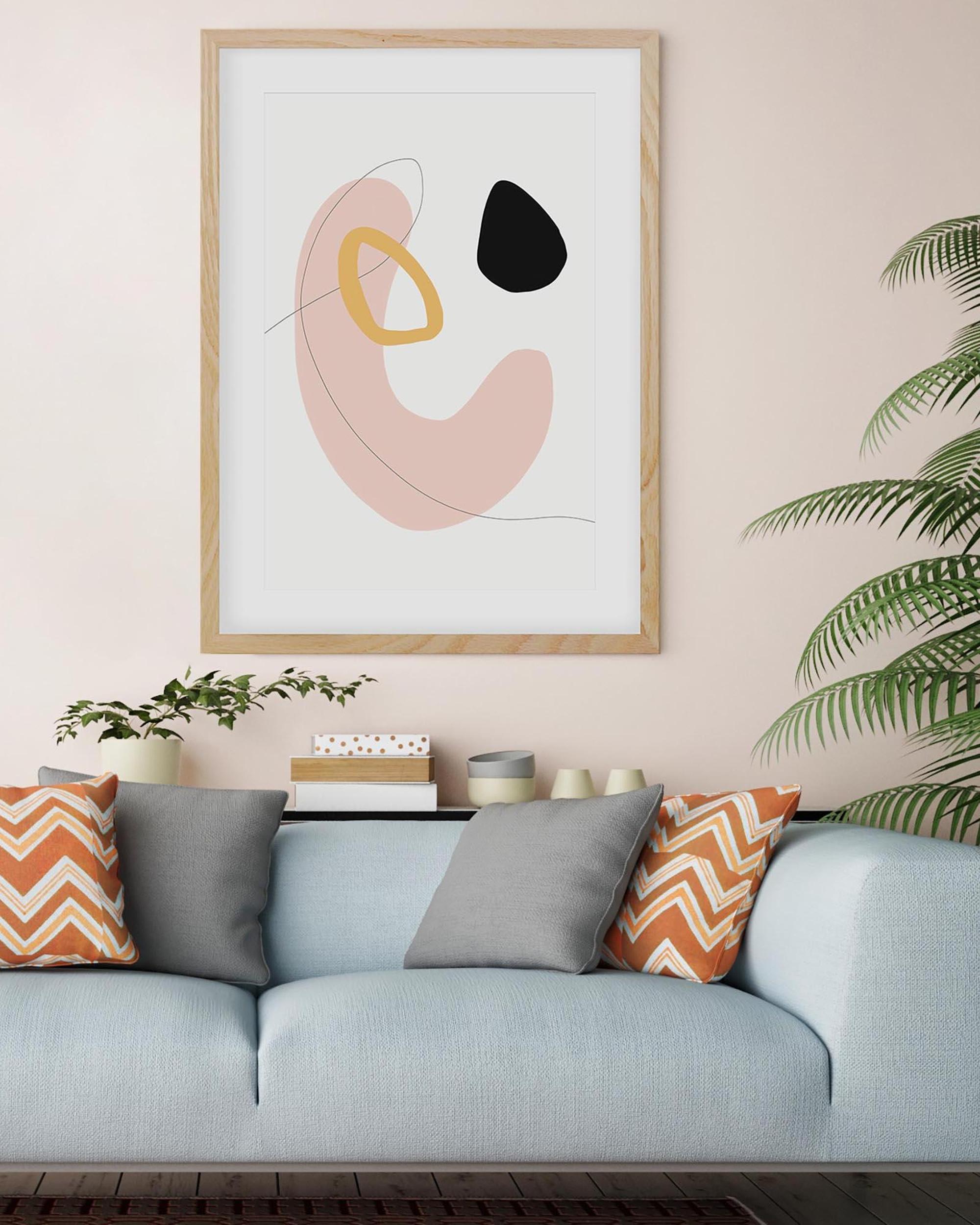 Modern living room with a light blue sofa, abstract art on the wall, and decorative pillows.