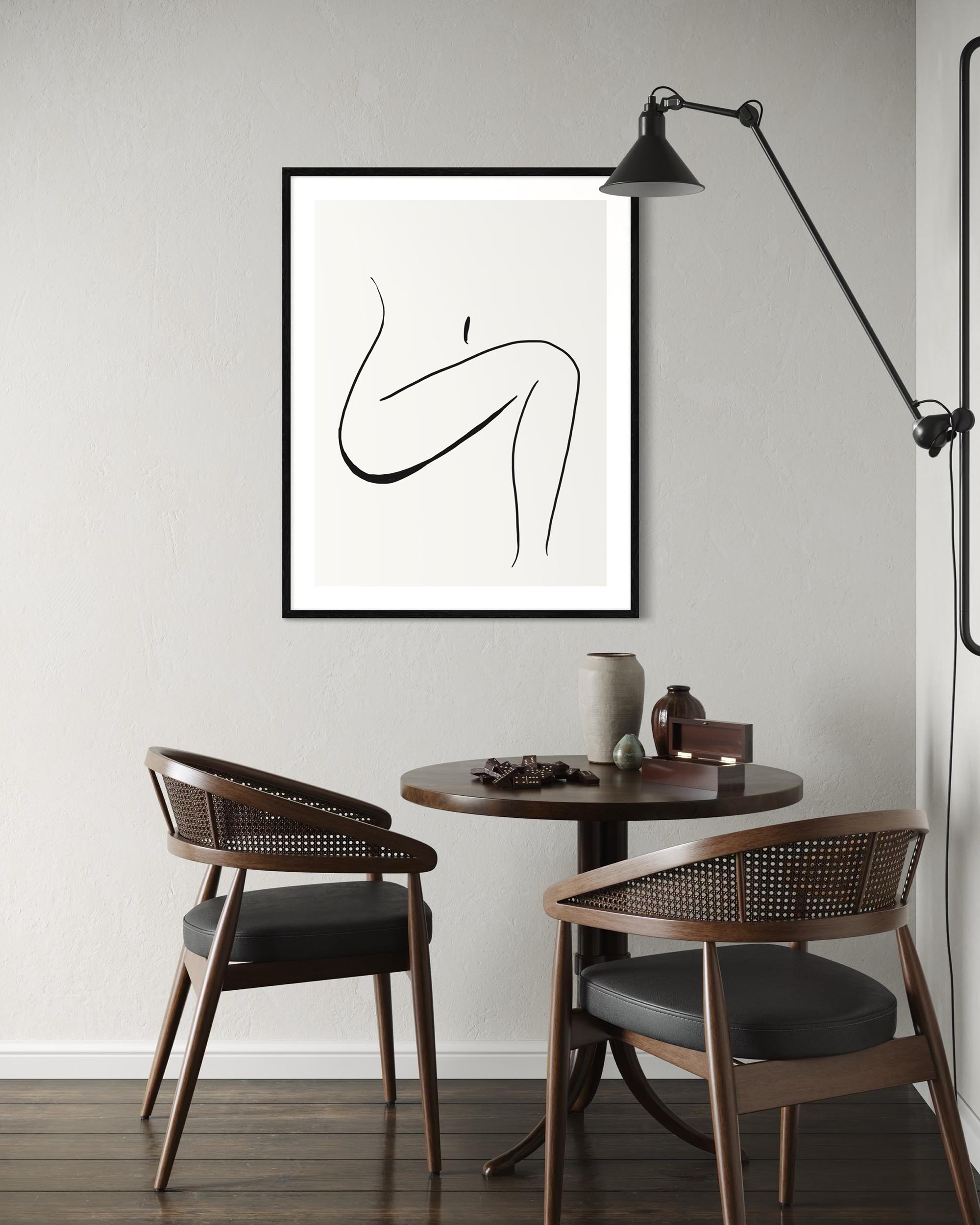 Modern interior with a table, chairs, and abstract art on the wall.