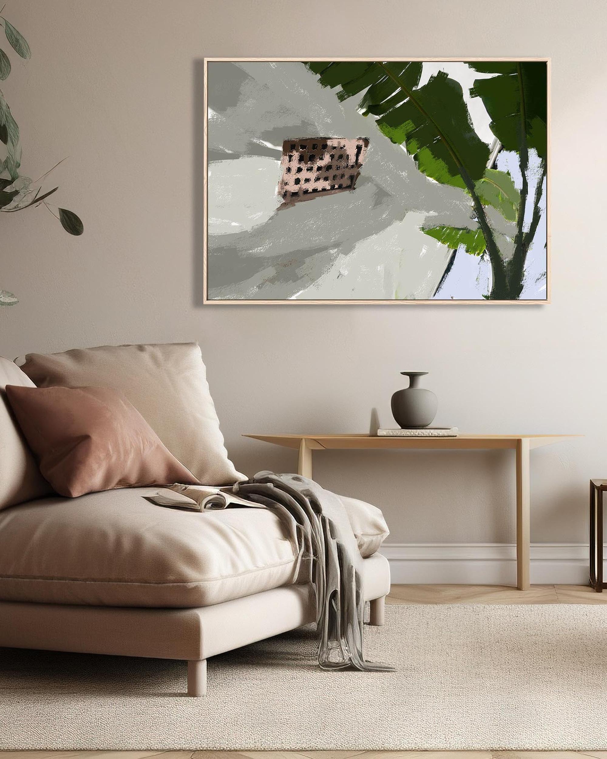 Modern living room with beige sofa, decorative pillows, and a framed abstract art piece.