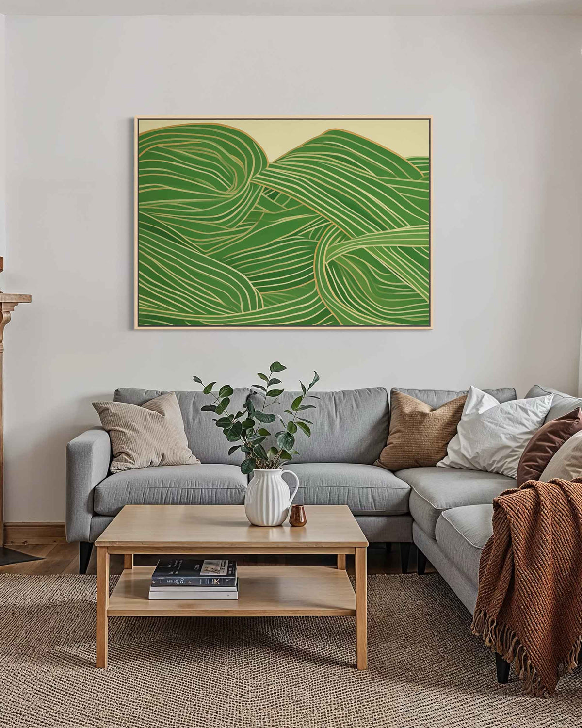 Living room with a gray sectional sofa, wooden coffee table, and green abstract art on the wall.