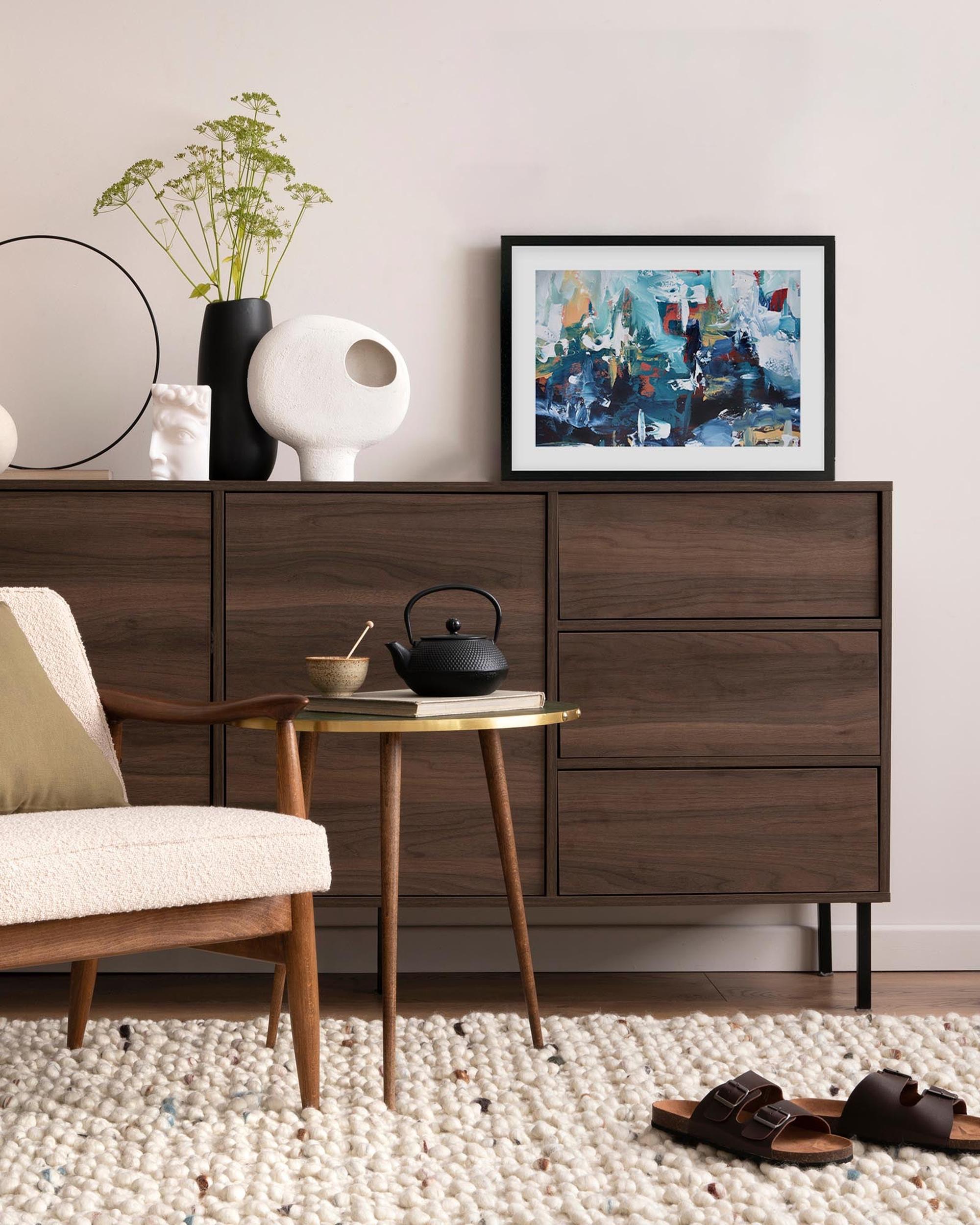 Modern living room with wooden furniture, a chair, and decorative items.