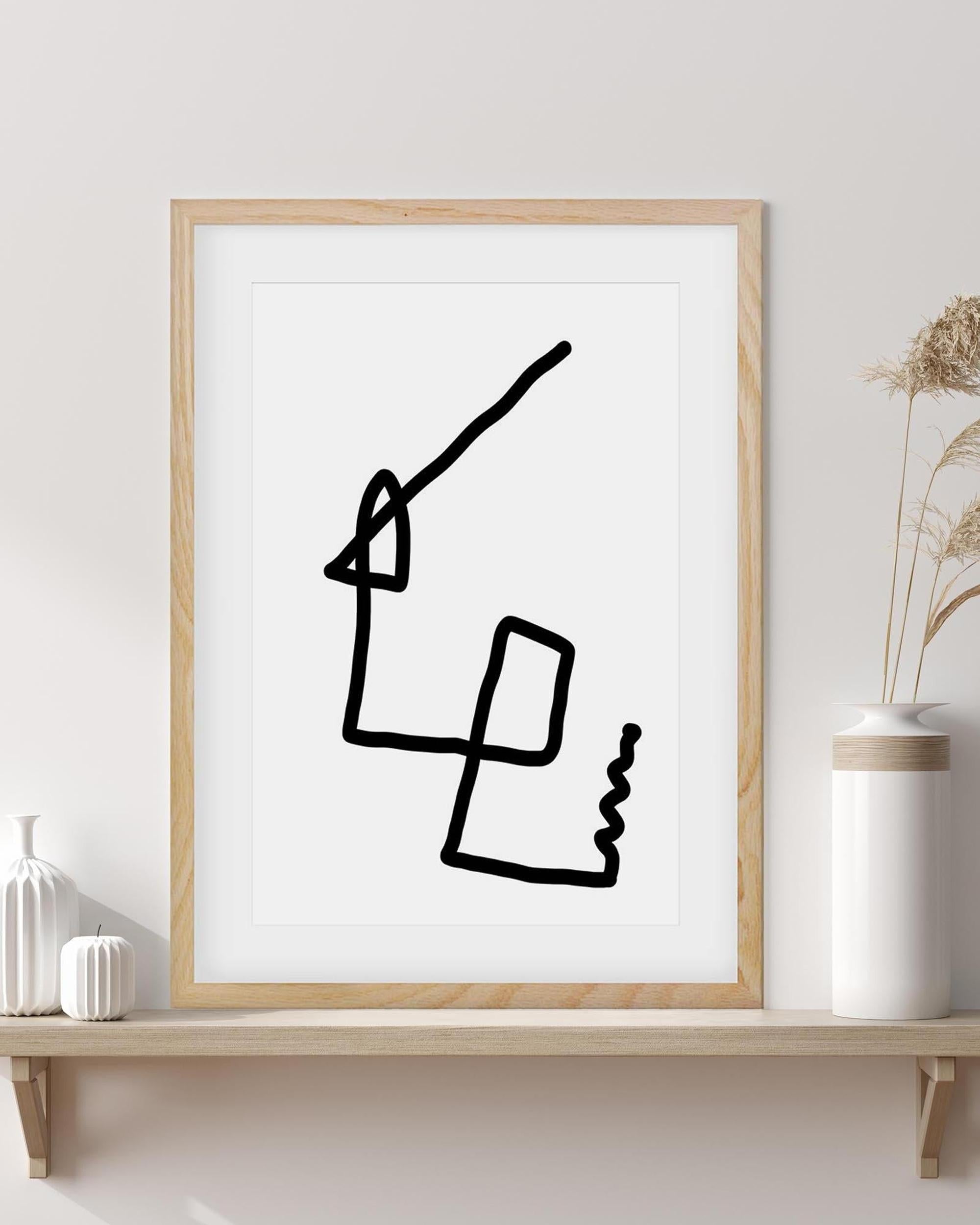 Framed abstract black line art on a white wall with decorative vases.