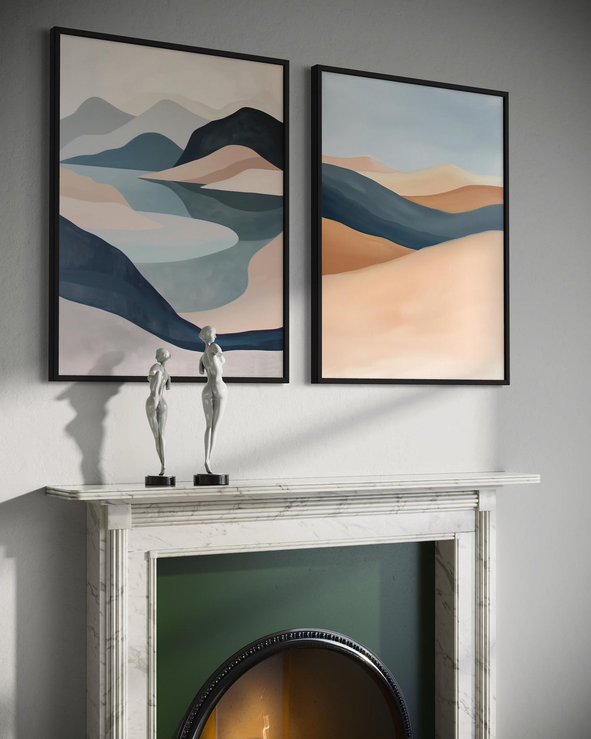 Two abstract landscape paintings above a fireplace with decorative statues.
