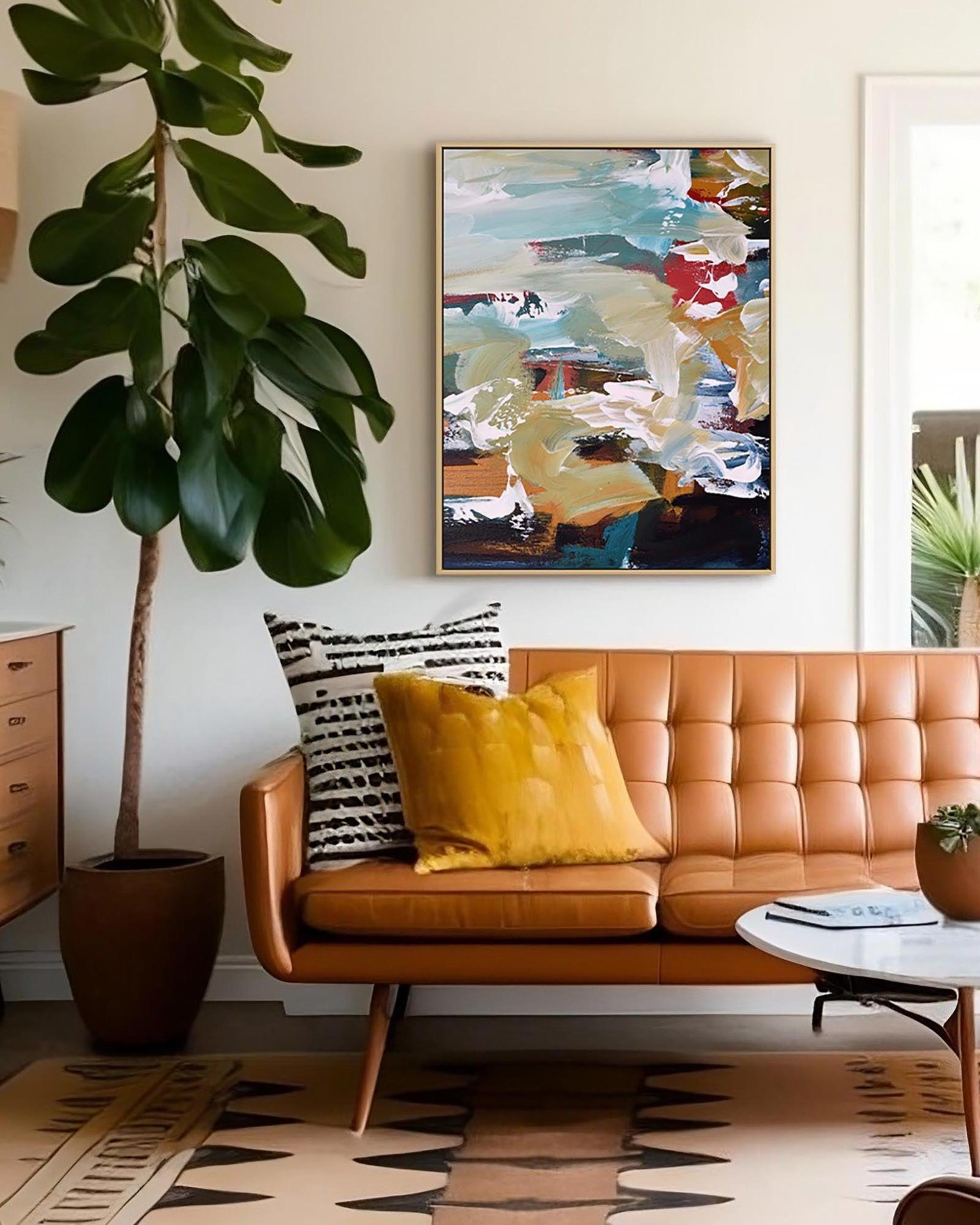 Living room with a brown leather sofa, abstract painting, and decorative pillows.