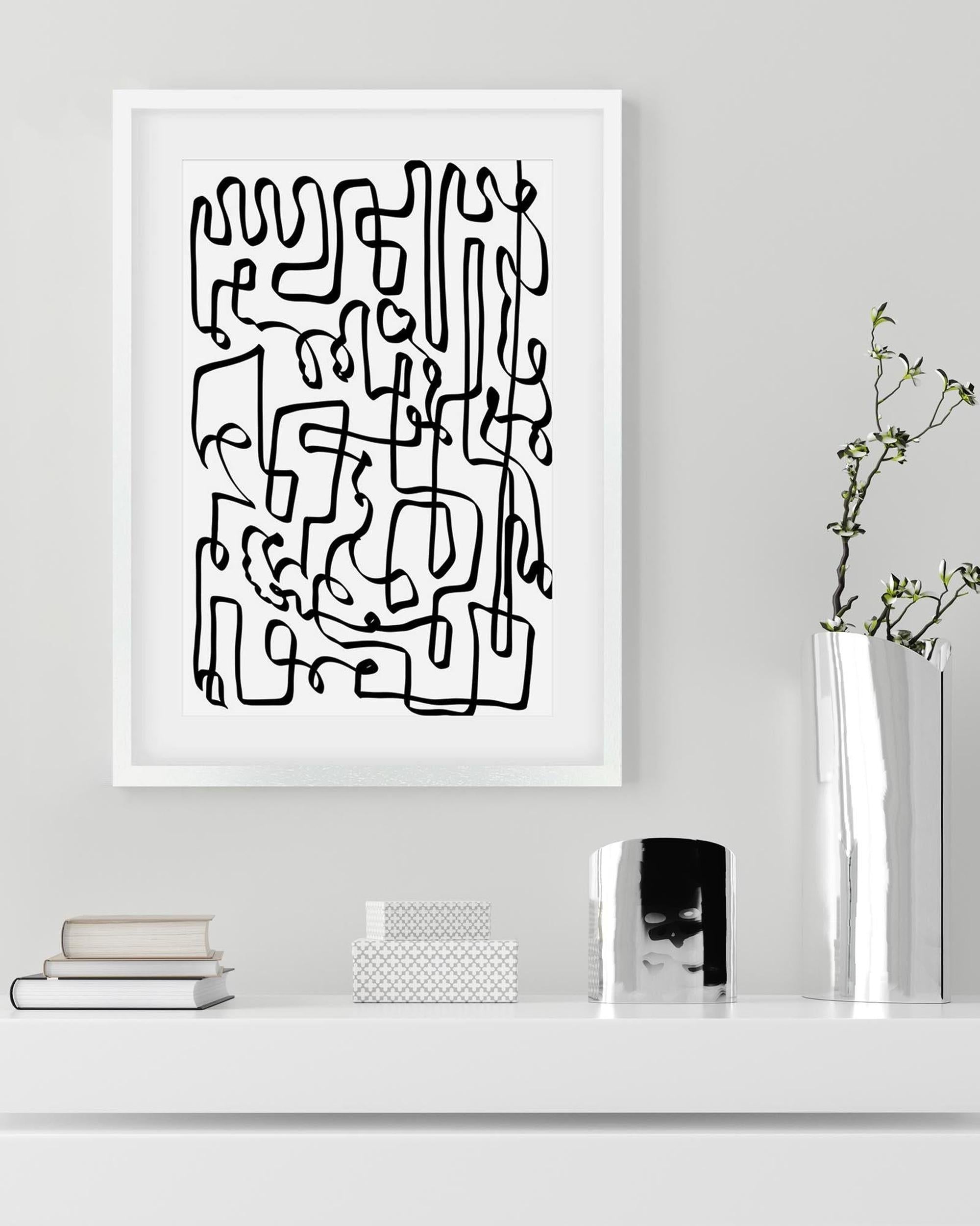 Framed abstract black line art on a white wall with decor items below.