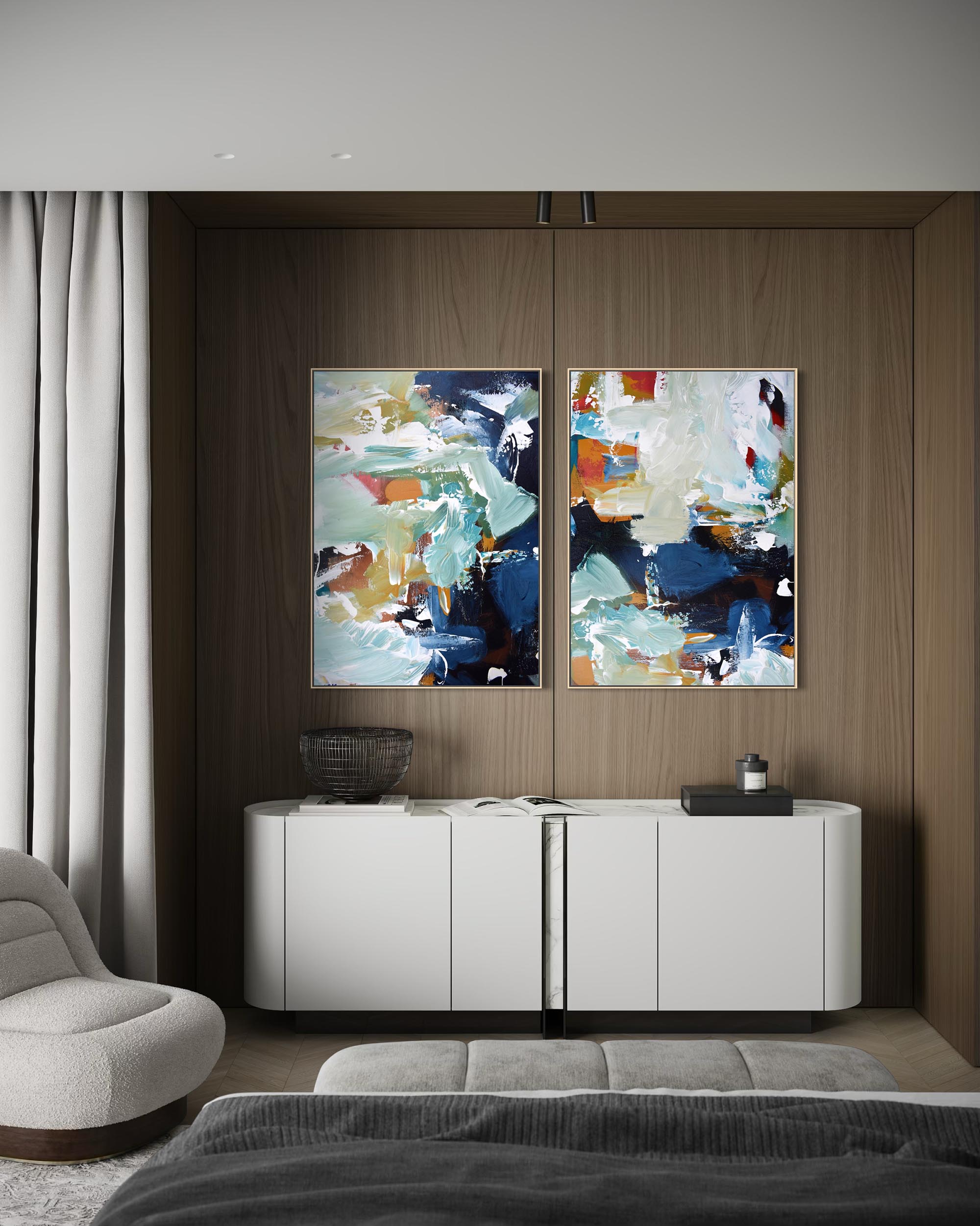 Two abstract paintings on a wall above a white cabinet in a modern living room.