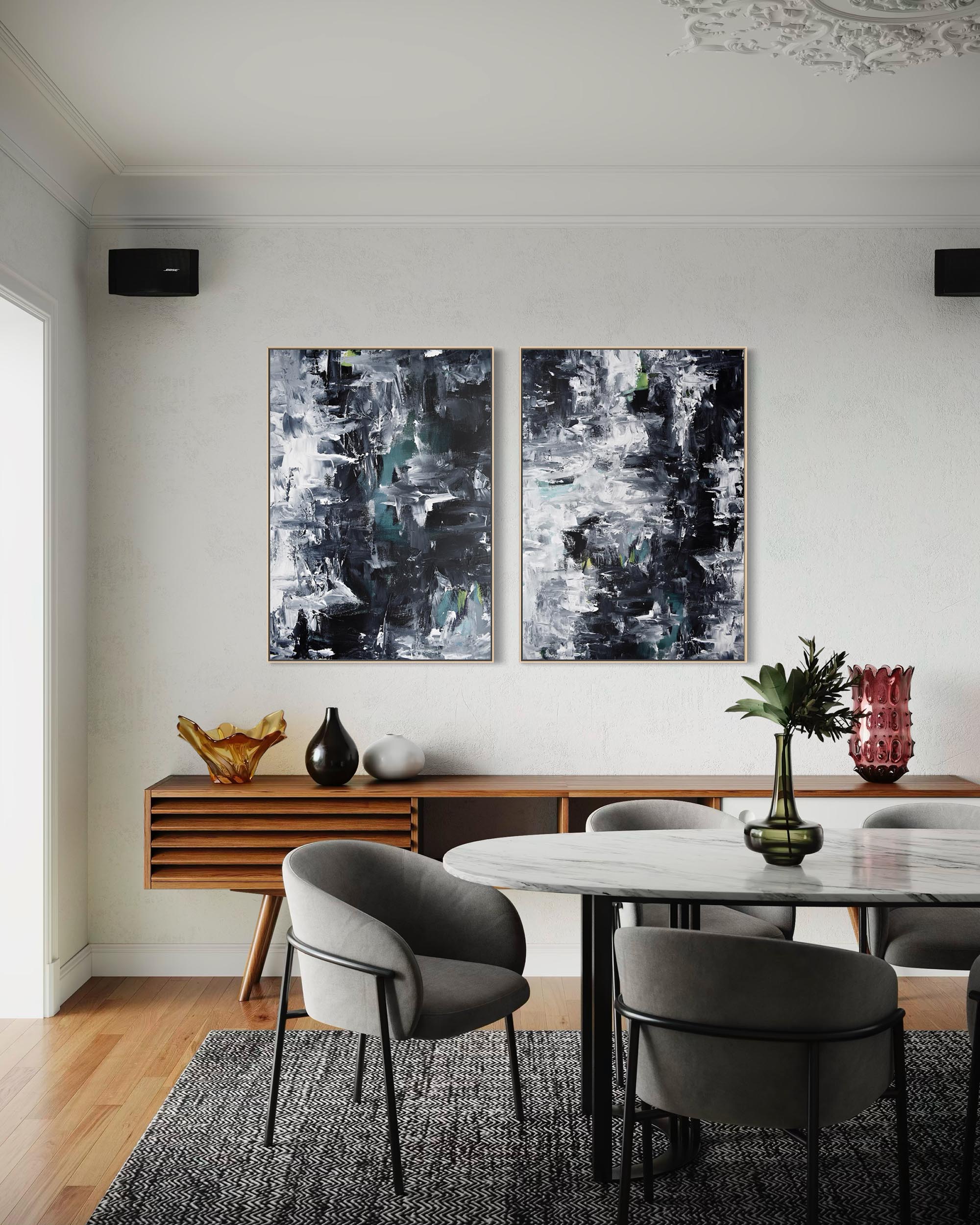 Dining room with abstract art on the wall, wooden console table, and chairs.