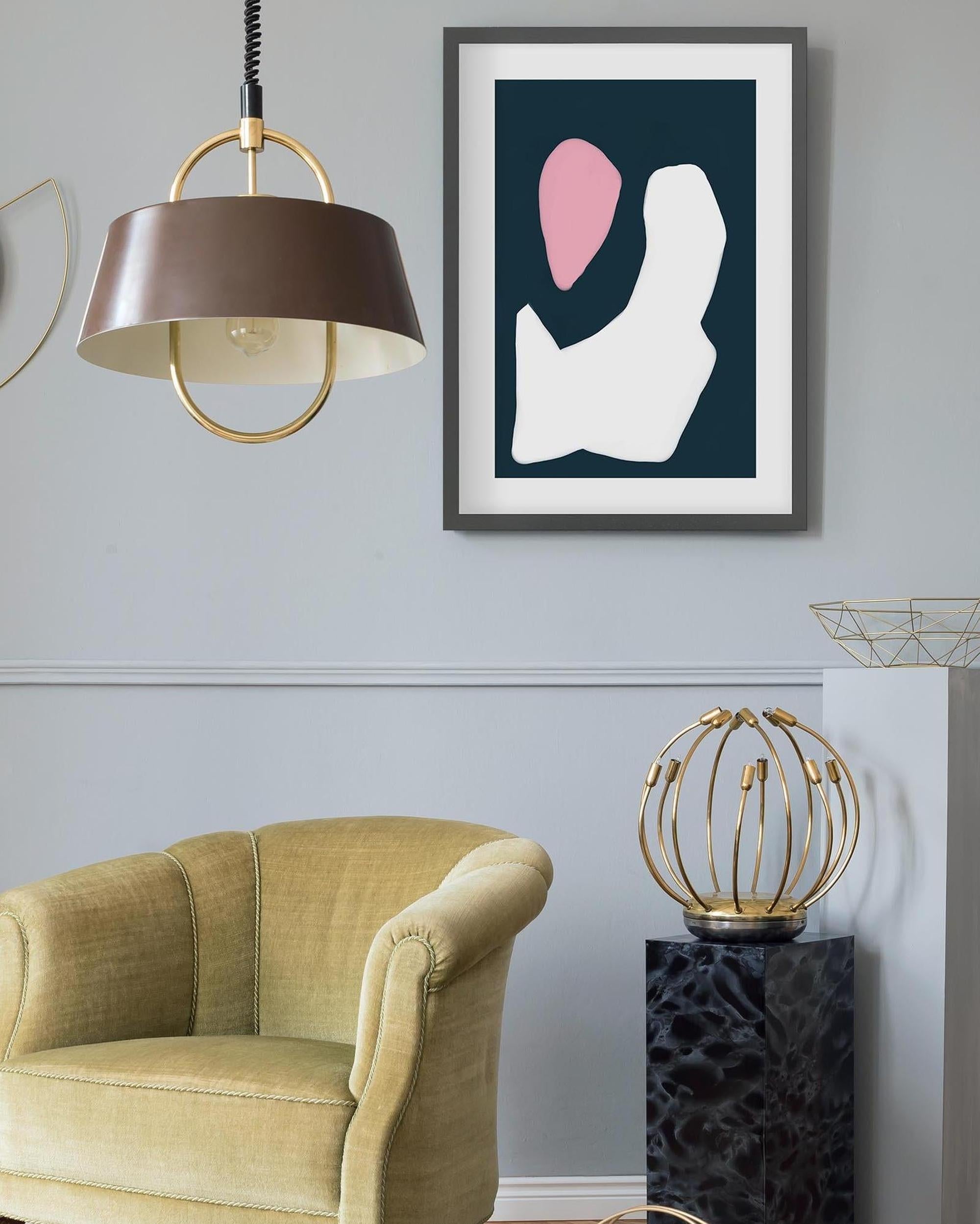 Modern living room with a yellow armchair, abstract art on the wall, and decorative lamp.