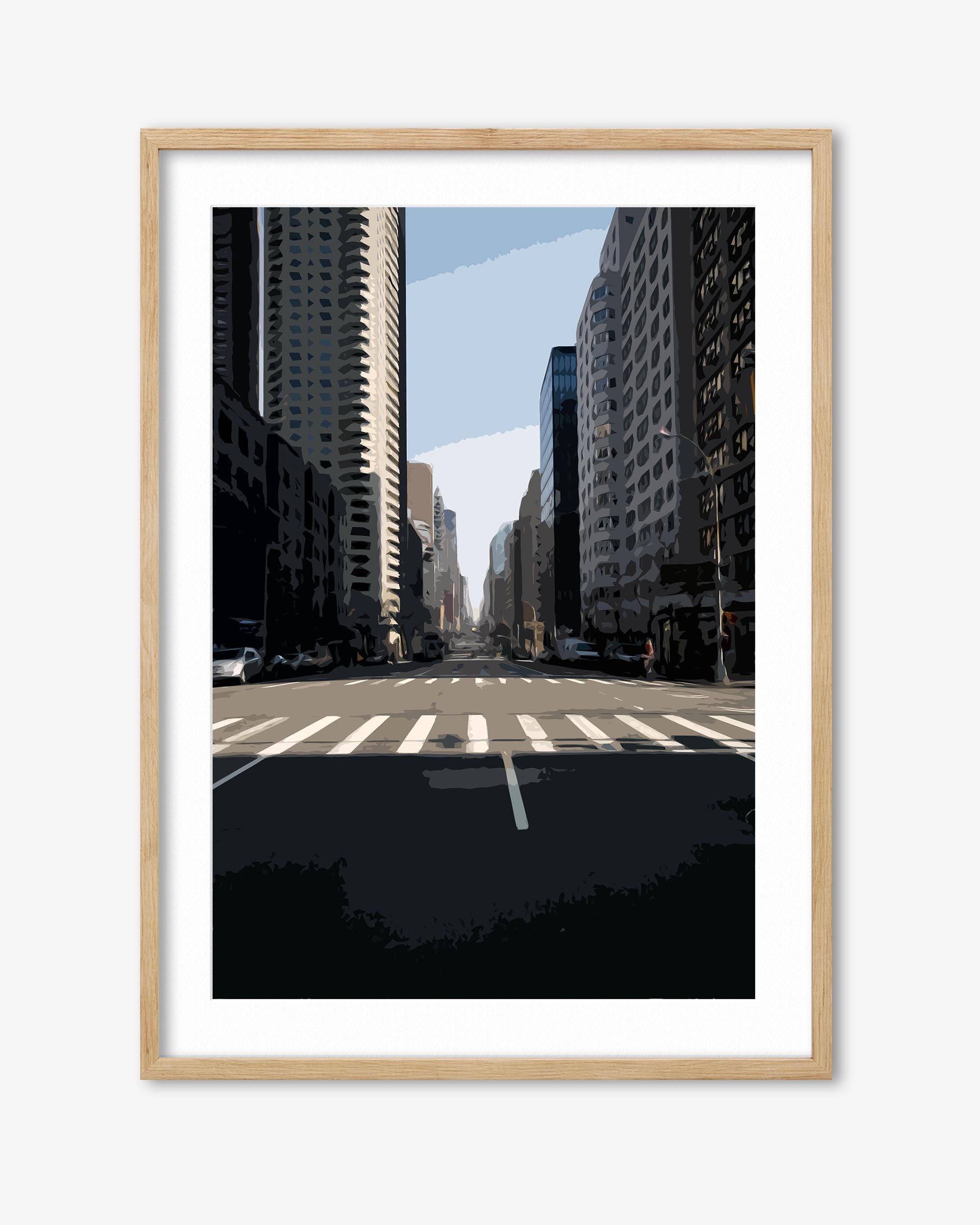 Framed city street with tall buildings and a clear sky