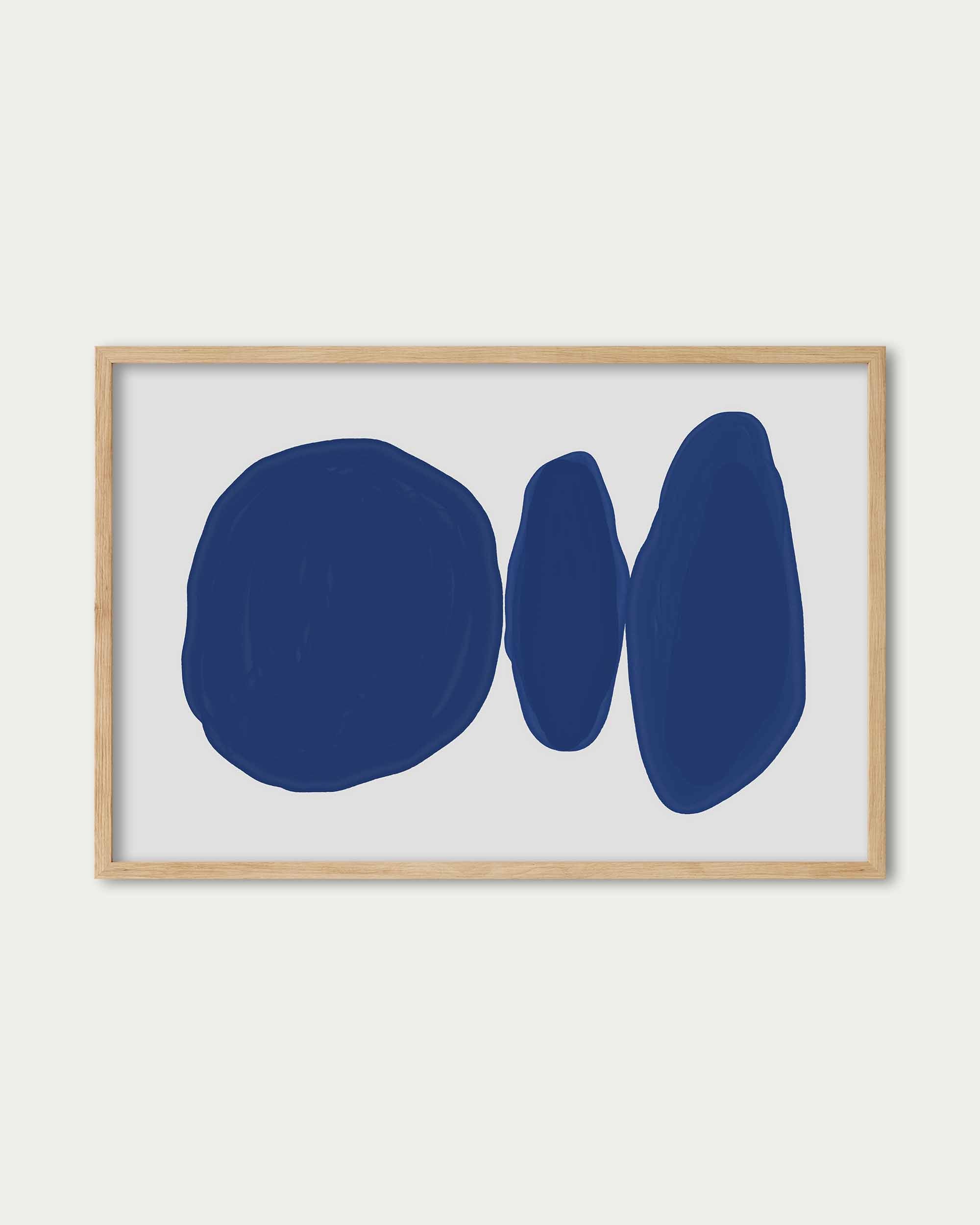 Framed abstract art with blue shapes on a white background