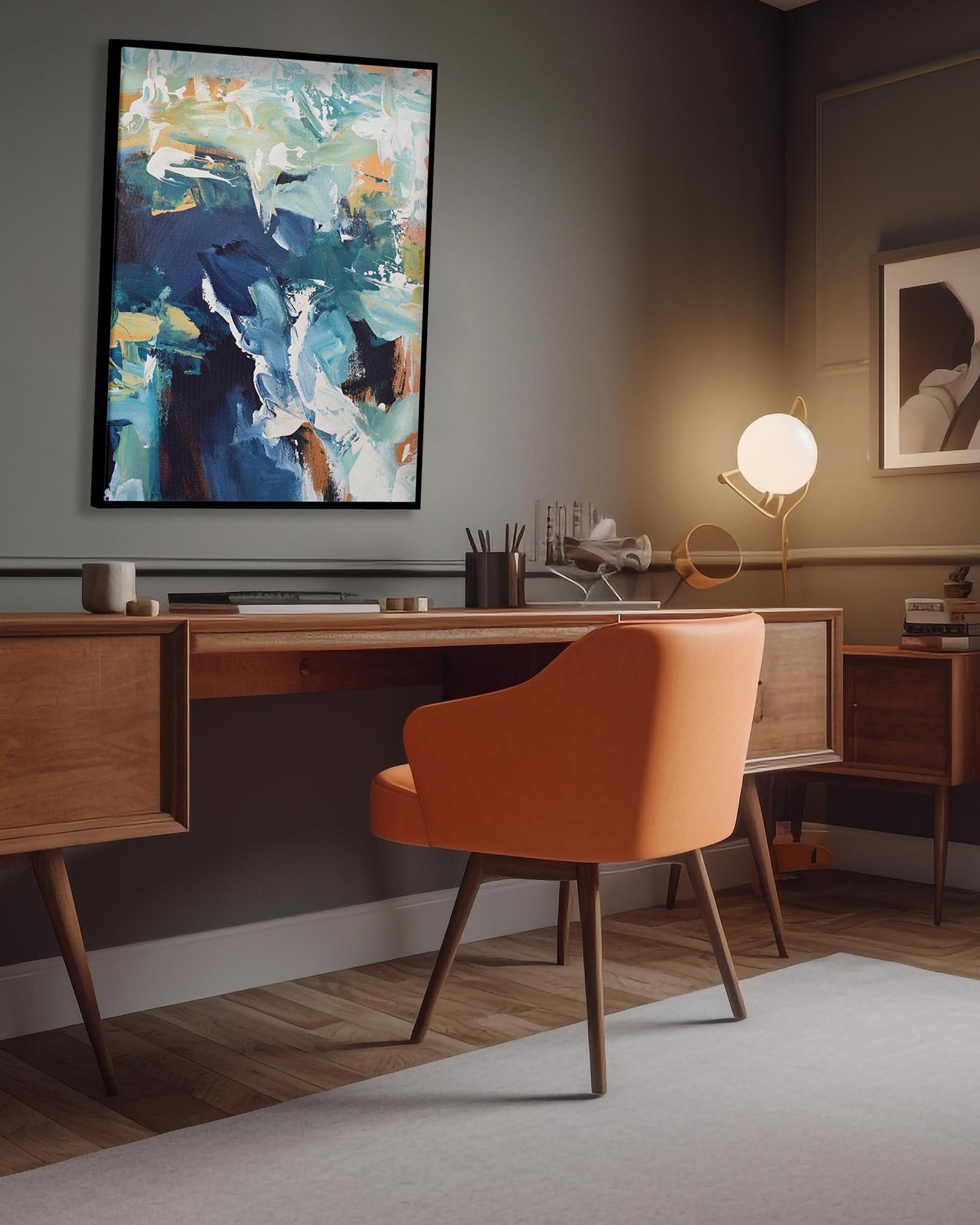 Modern office space with a wooden desk, orange chair, and abstract painting on the wall.