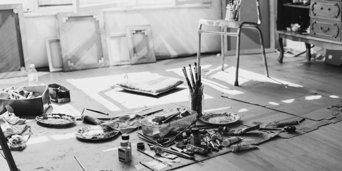 artist studio oil paint and brushes on the floor