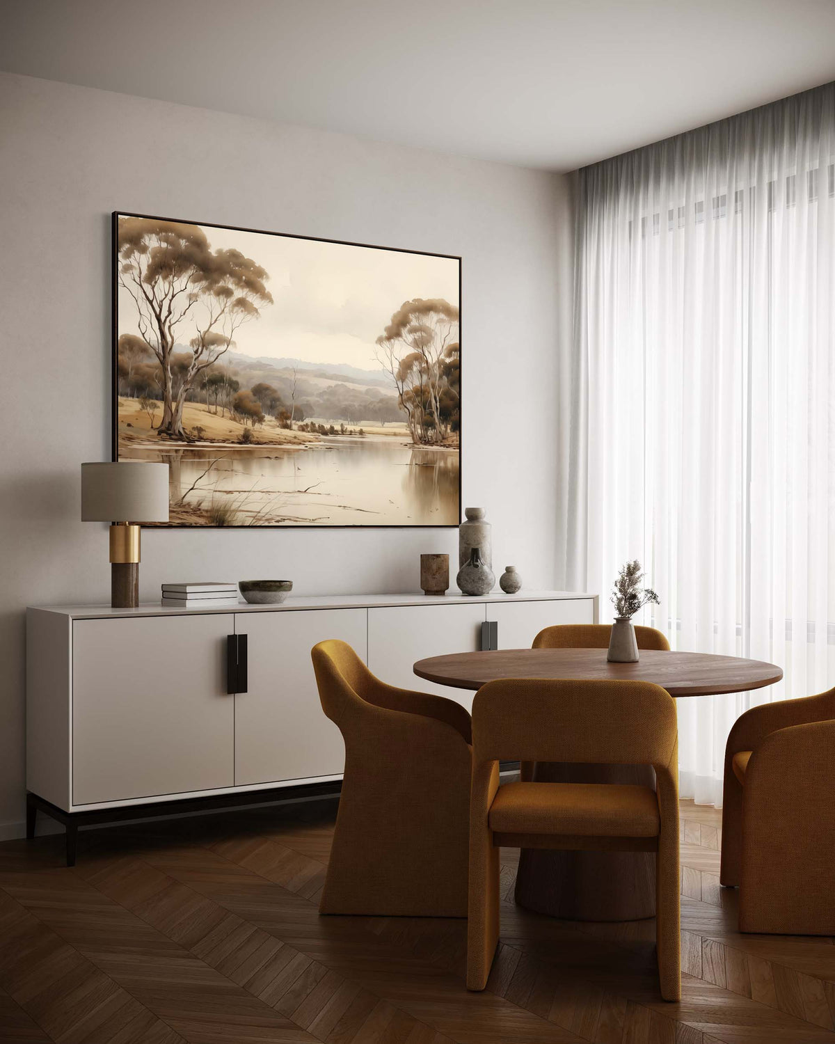 Modern dining room with a large landscape painting on the wall, white sideboard, and wooden table.