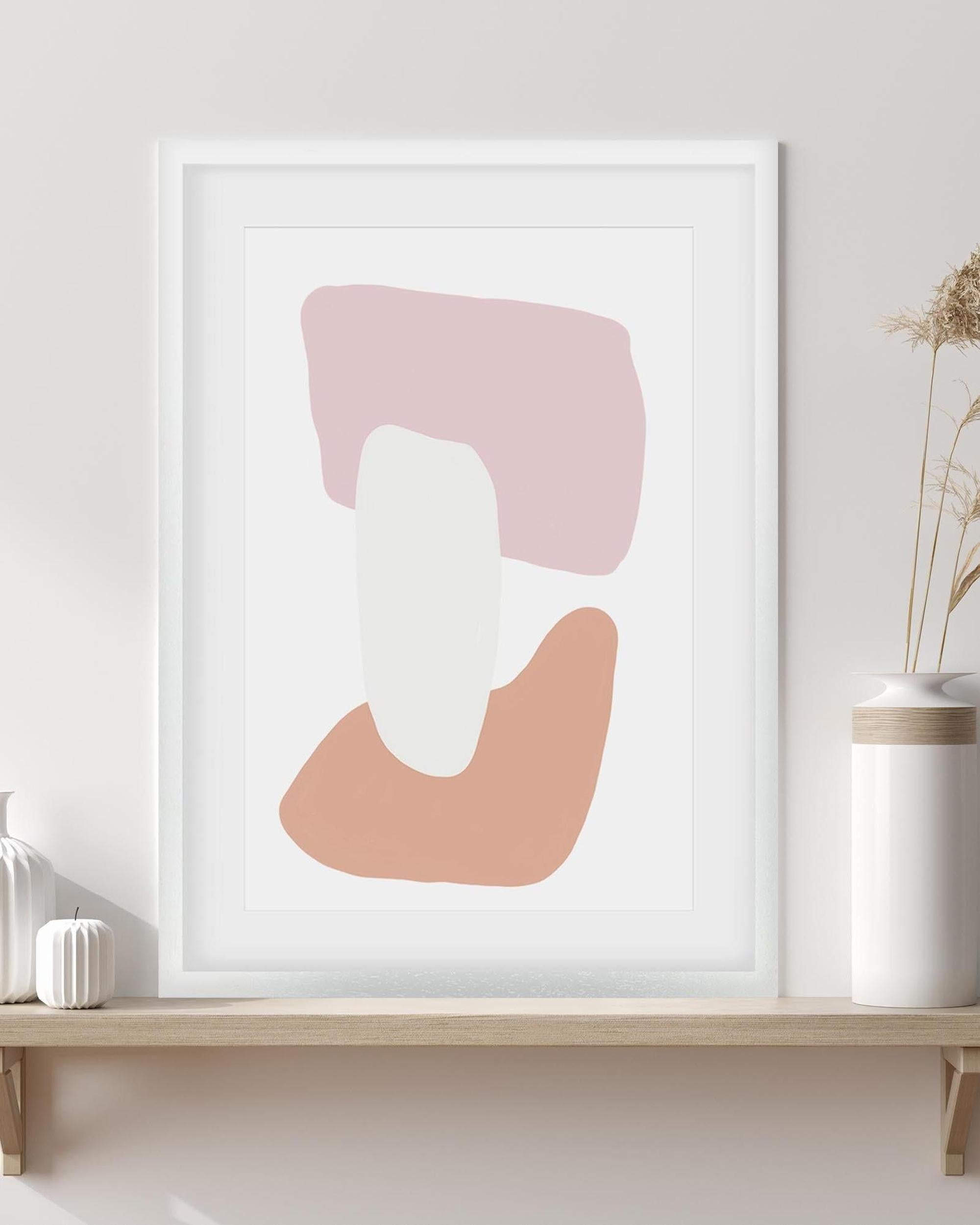 Abstract art print with pink and white shapes in a white frame on a wall.