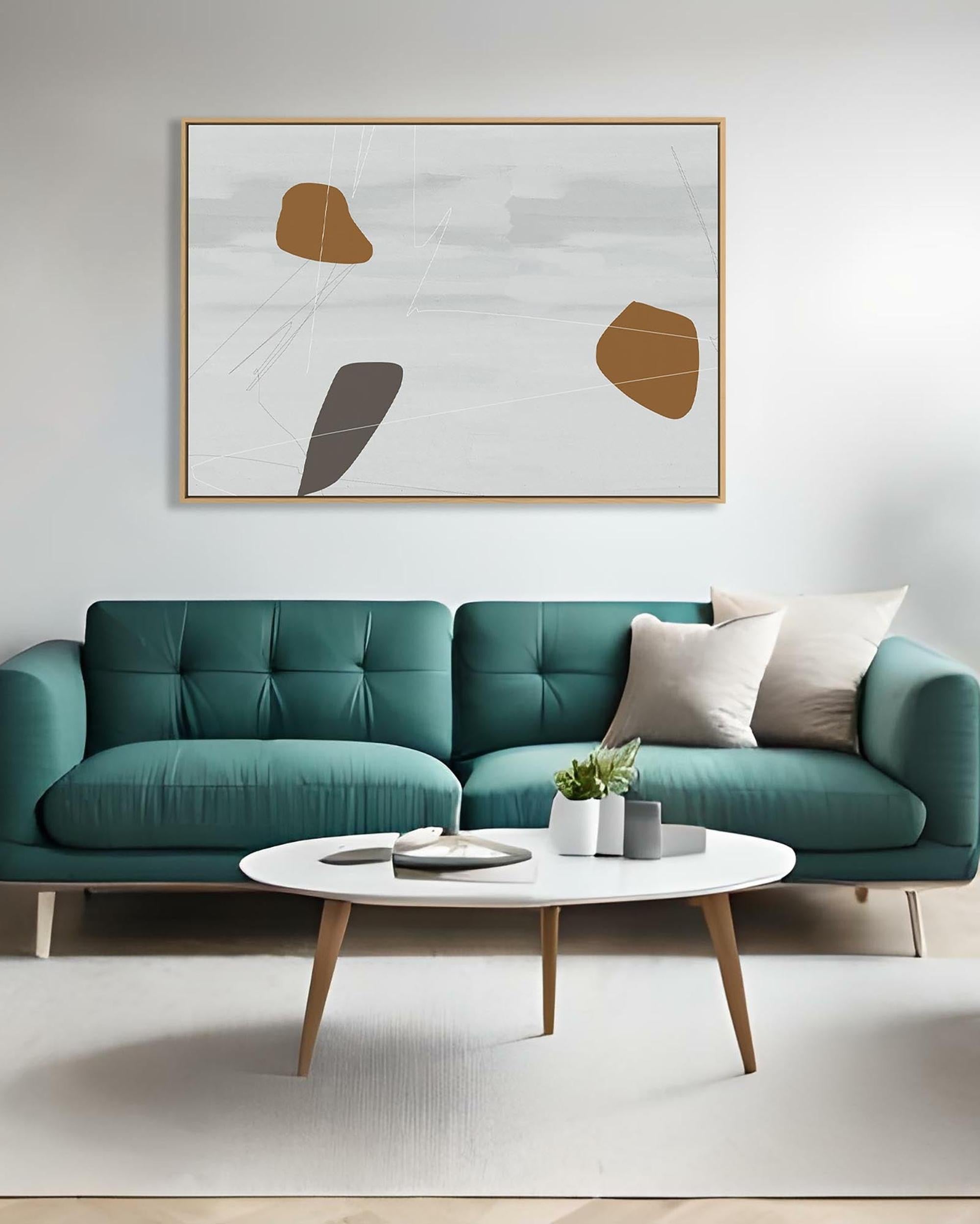 Modern living room with teal sofa, round coffee table, and abstract art on the wall.