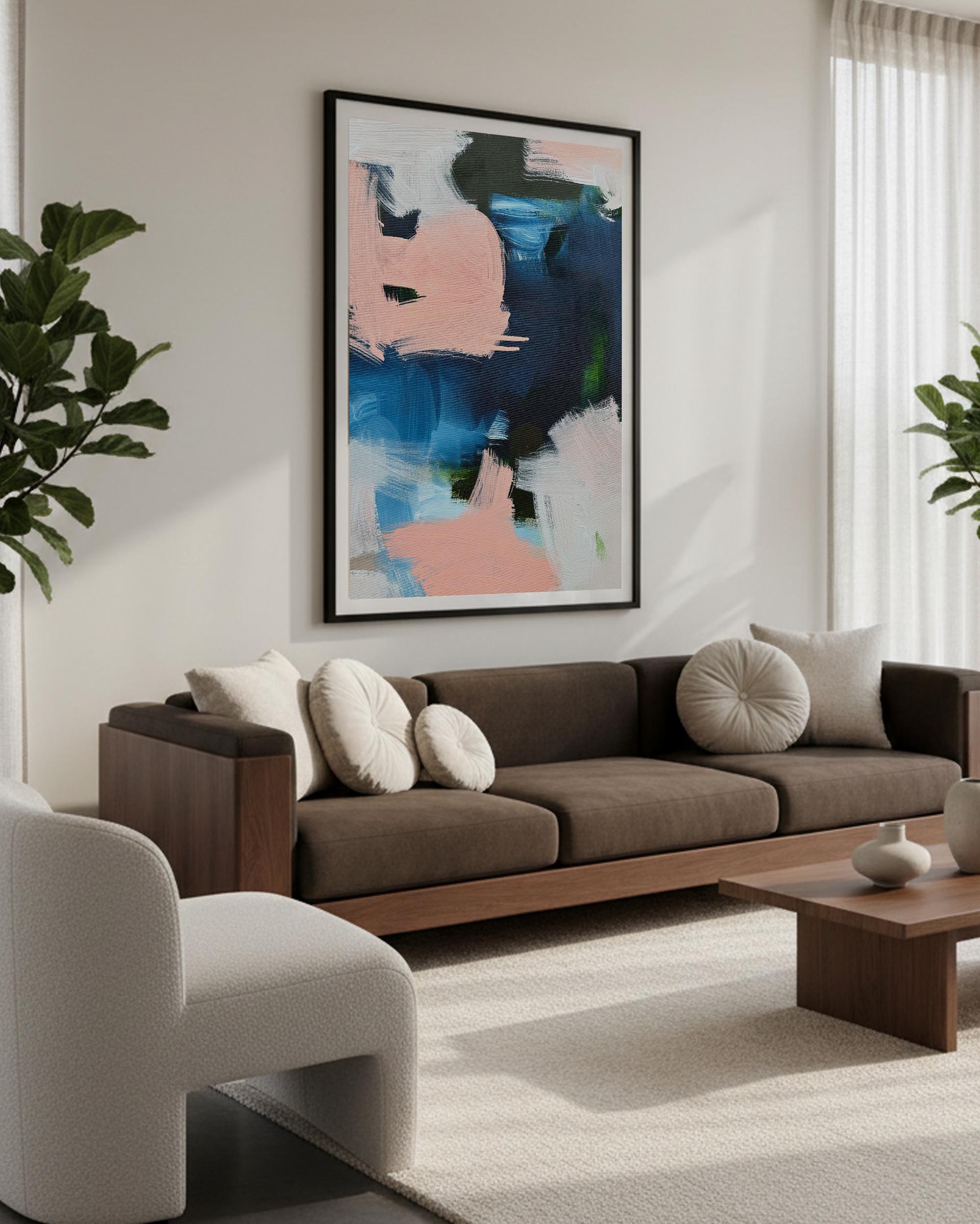 Modern living room with a brown sofa, abstract art, and decorative items.