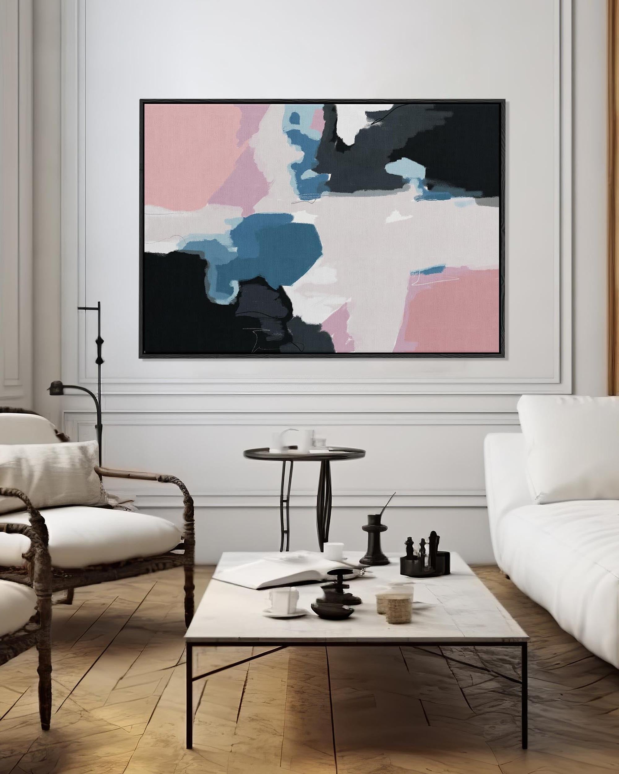 Modern living room with abstract art, white sofa, and coffee table.