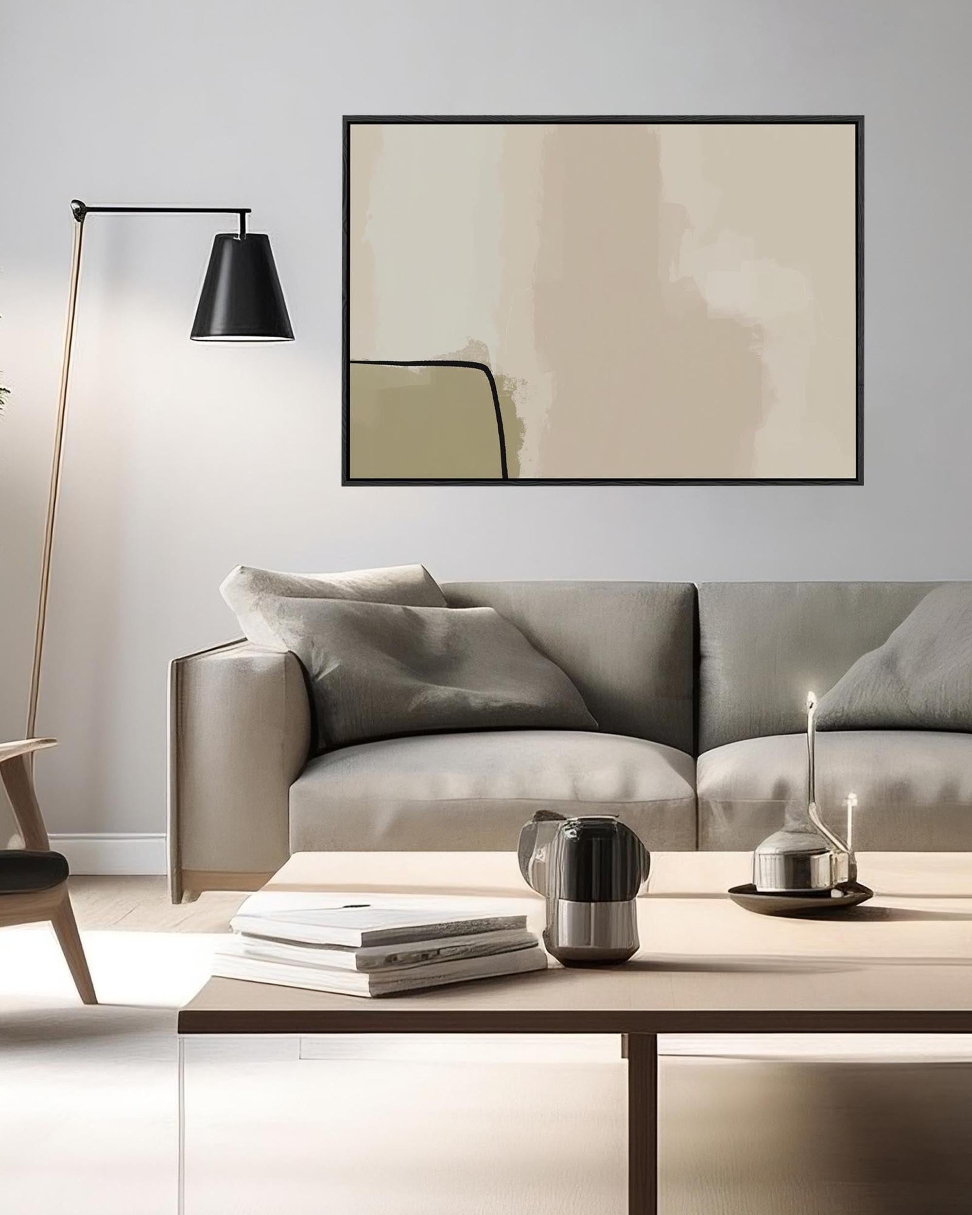 Modern living room with a gray sofa, coffee table, and wall art.