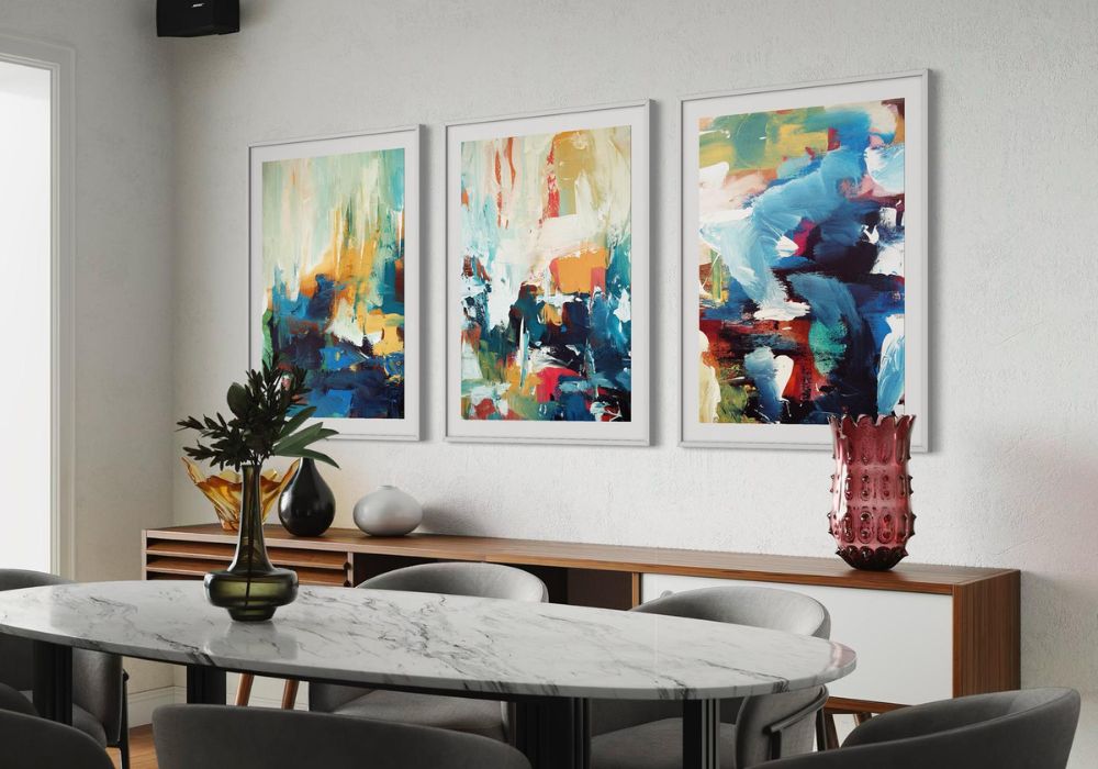 Dining room with a marble table and abstract art on the wall