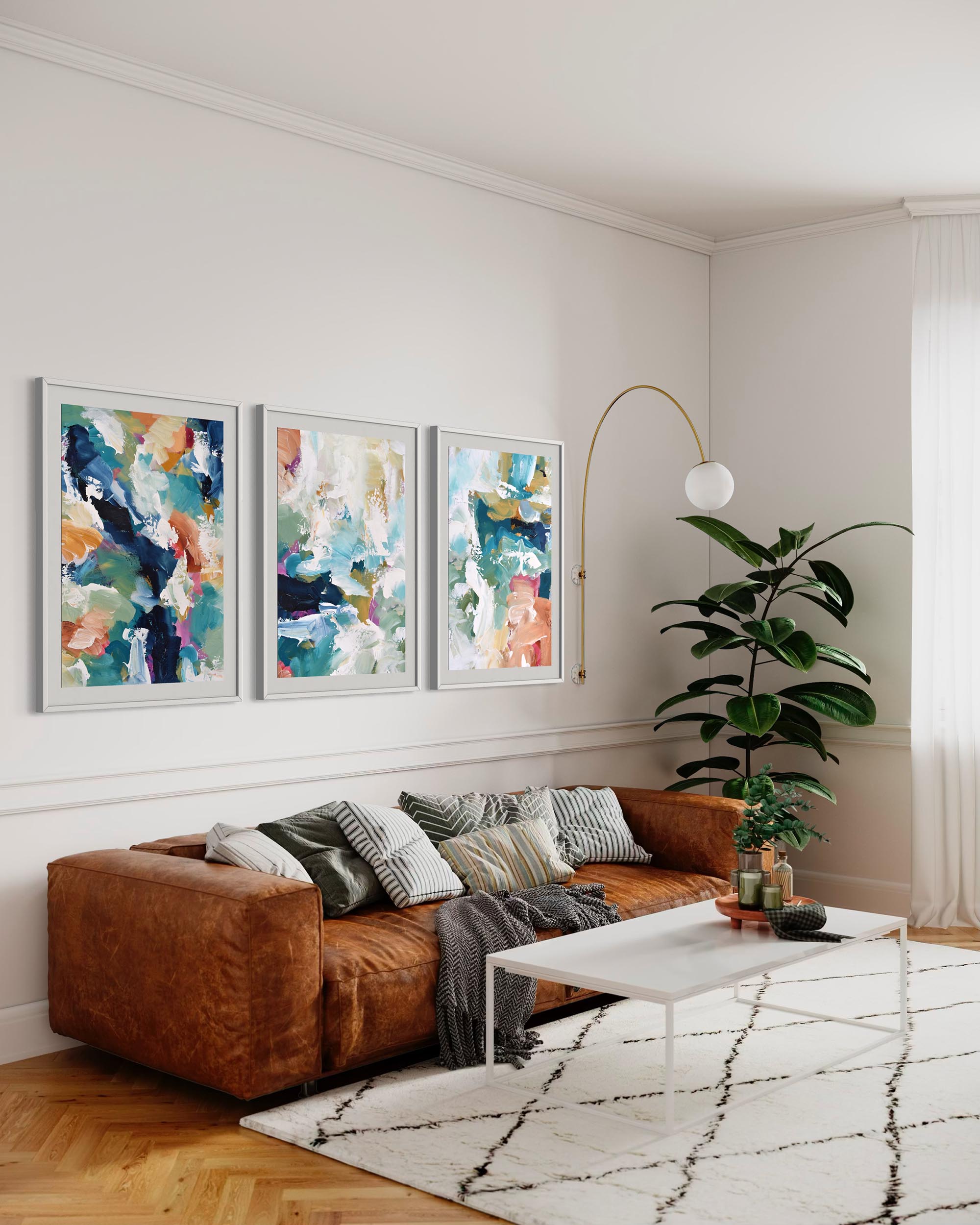 Living room with brown sofa, abstract art on the wall, and a plant.
