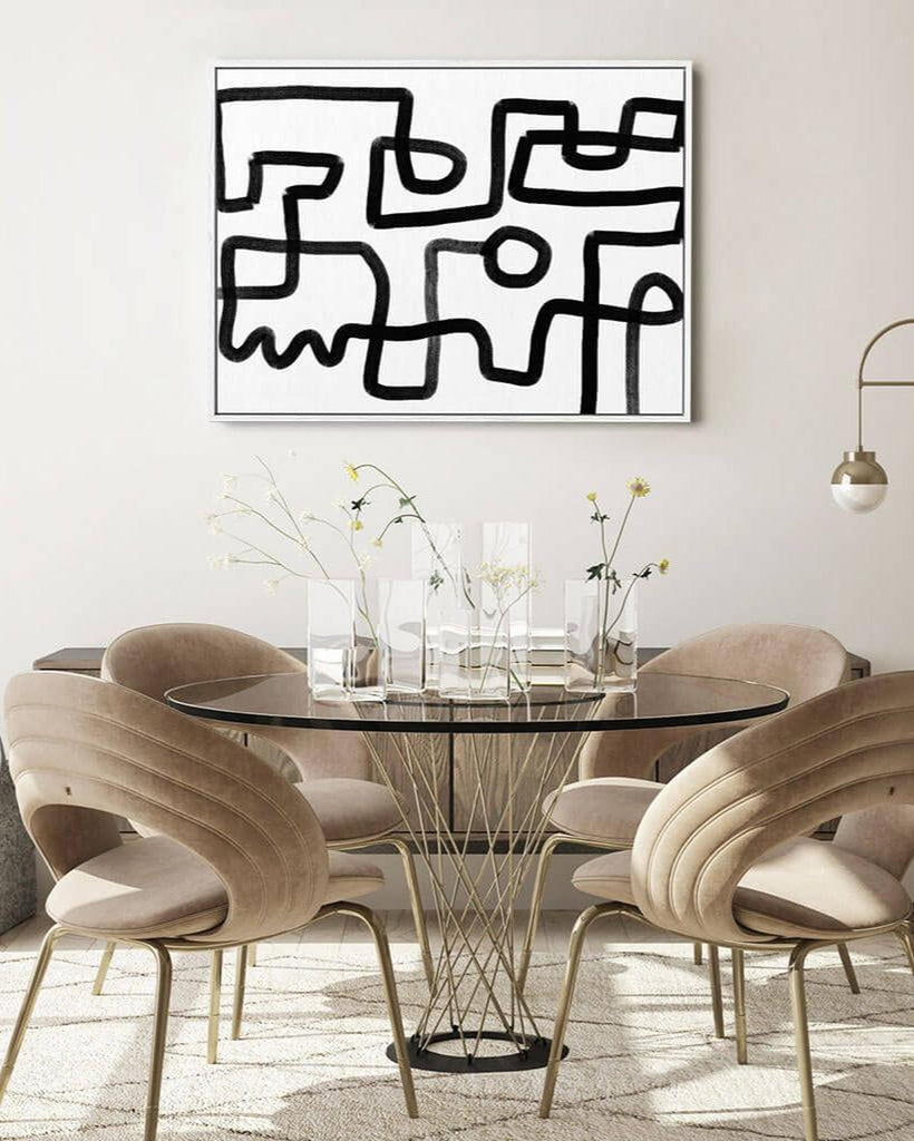 Modern dining room with round glass table and wavy chairs, abstract art on the wall.