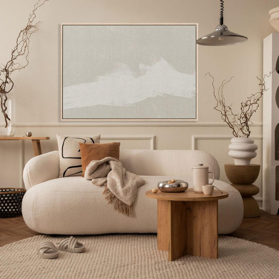 Large abstract canvas artwork above a sofa in a modern living room