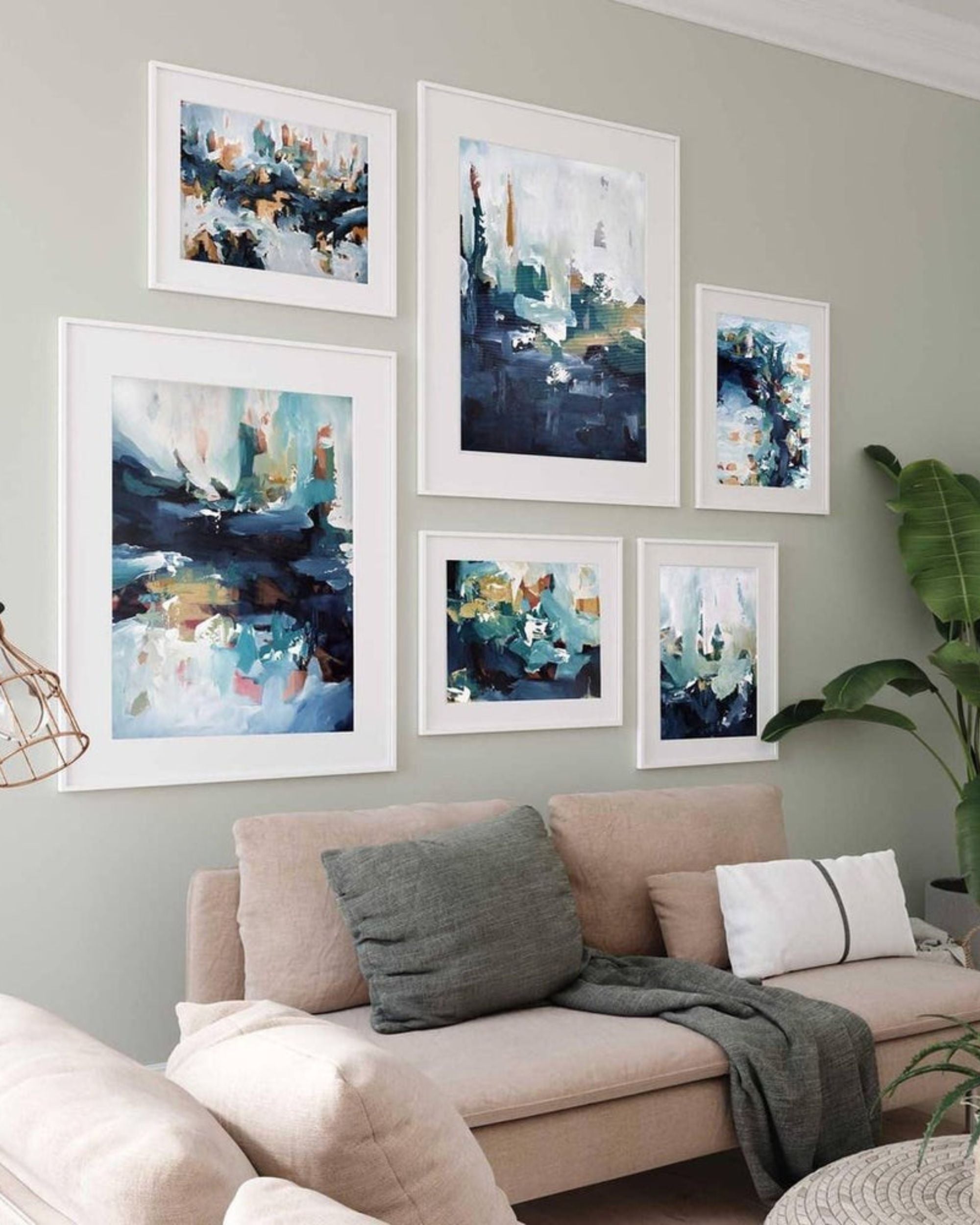 gallery wall art of framed abstract prints in a living room
