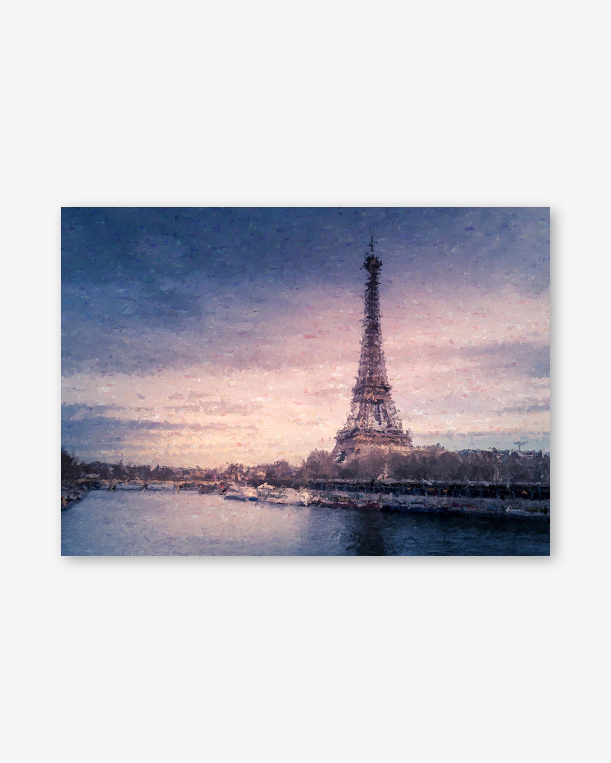 Eiffel Tower at sunset with a pink and blue sky.