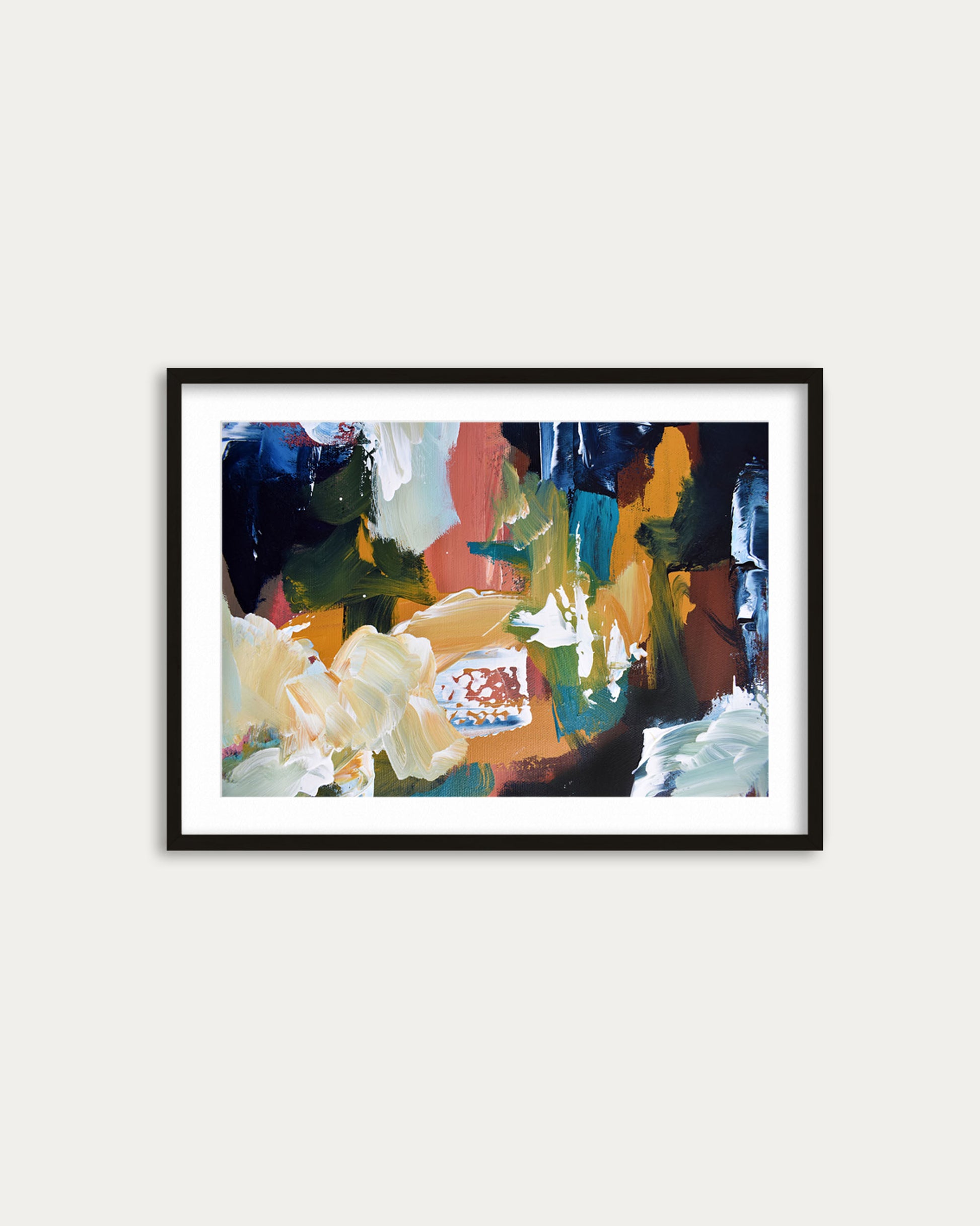 Framed abstract painting with colorful abstract design on a white wall