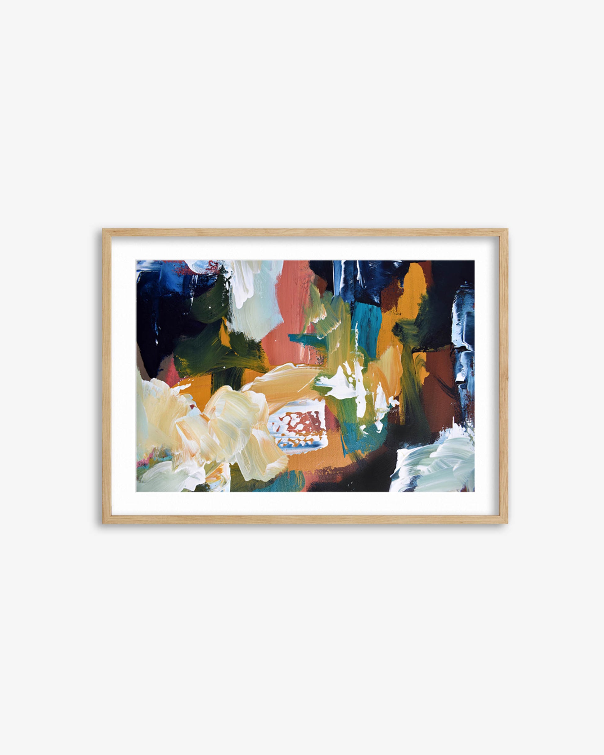 Framed abstract painting with colorful brush strokes on a white wall