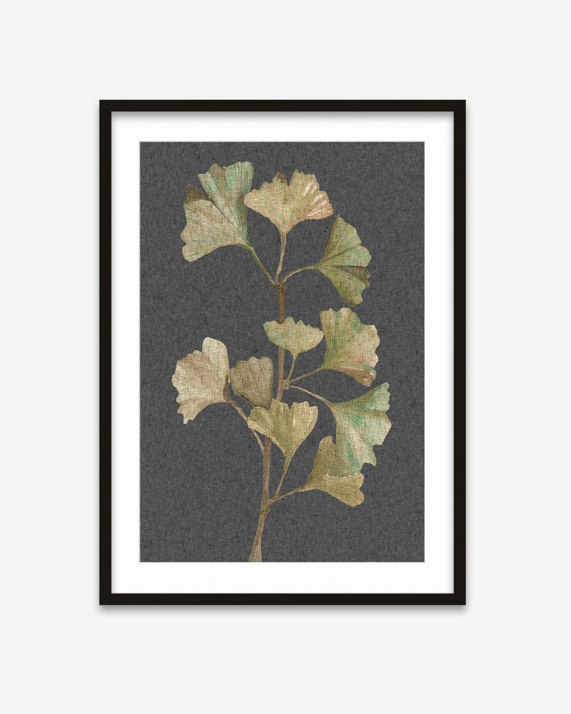 Framed artwork of ginkgo leaves on a dark gray background