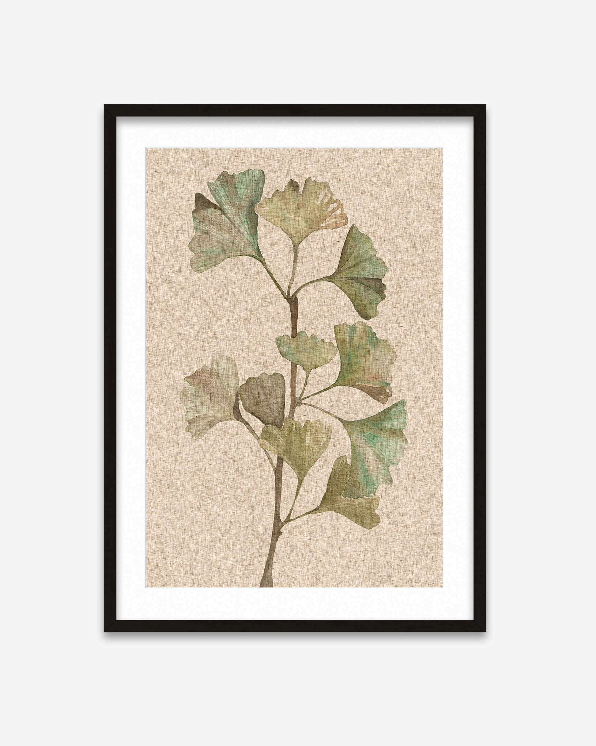 Framed artwork of a ginkgo biloba leaf on a textured beige background