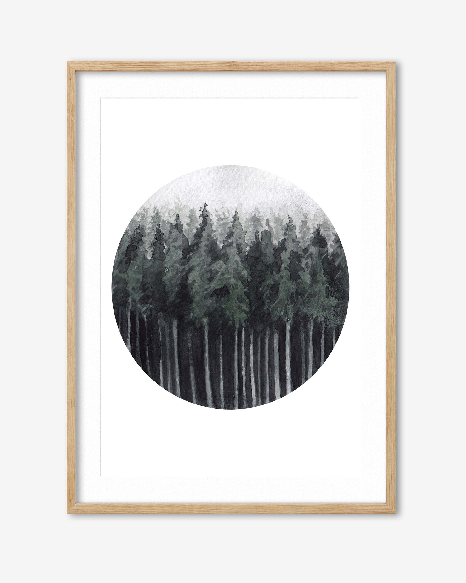 Framed artwork of a snowy forest scene with a circular inset