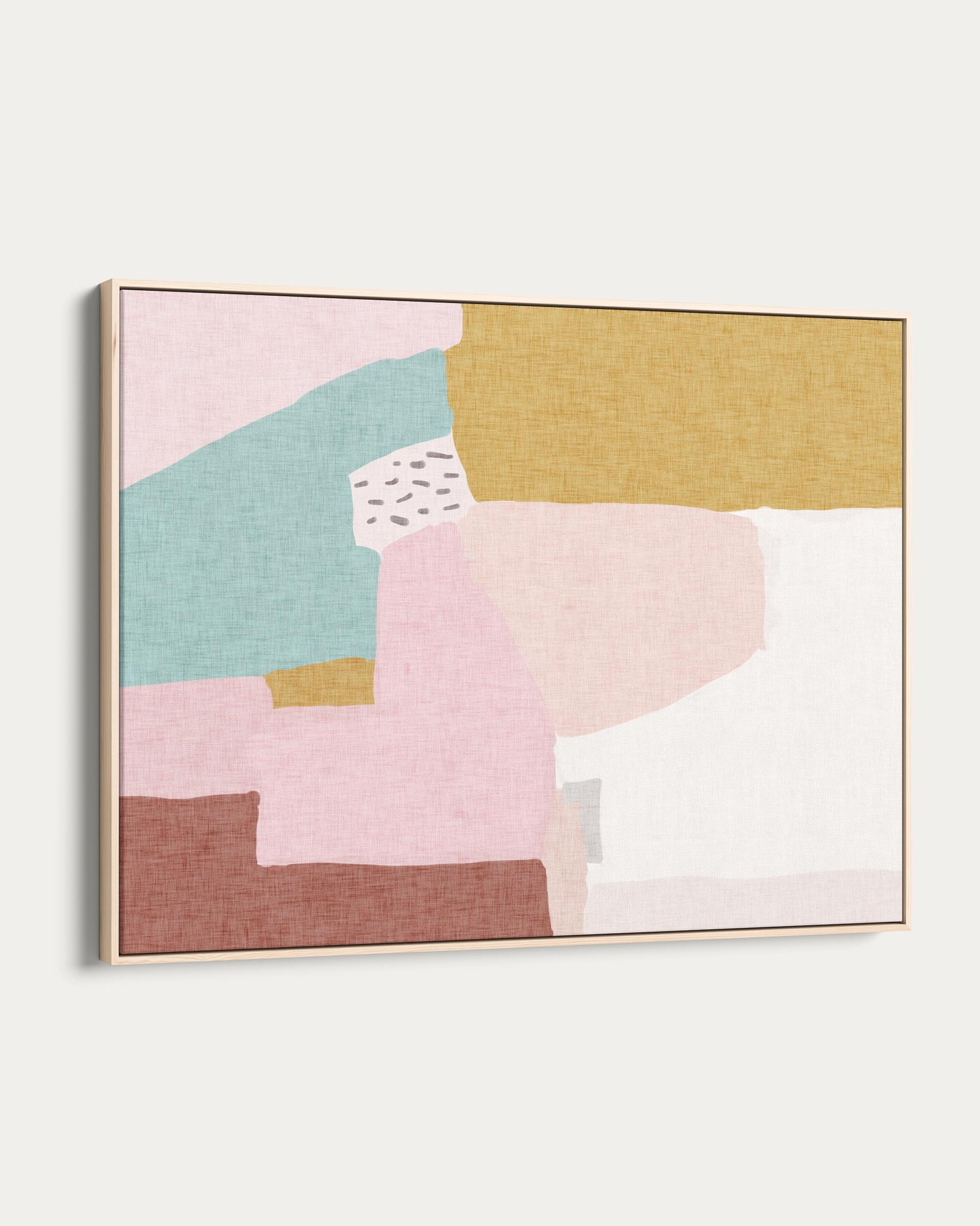 Abstract art piece with geometric shapes in pastel colors on a white wall