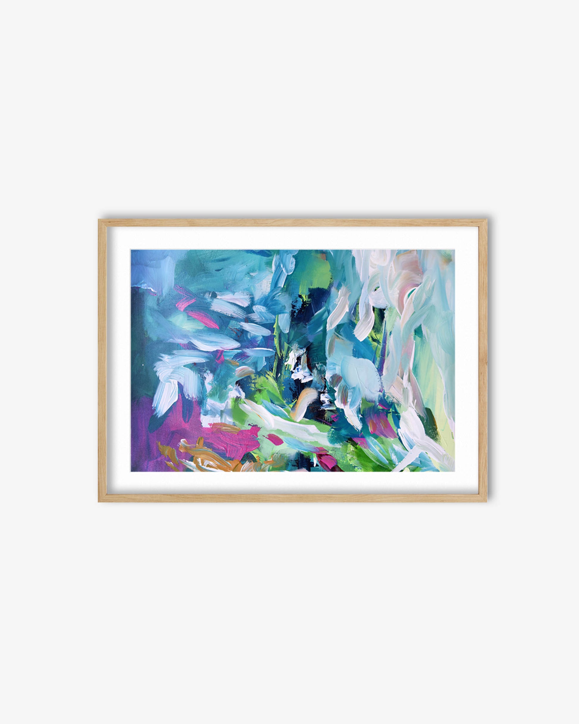Framed abstract painting with colorful brushstrokes on a white wall