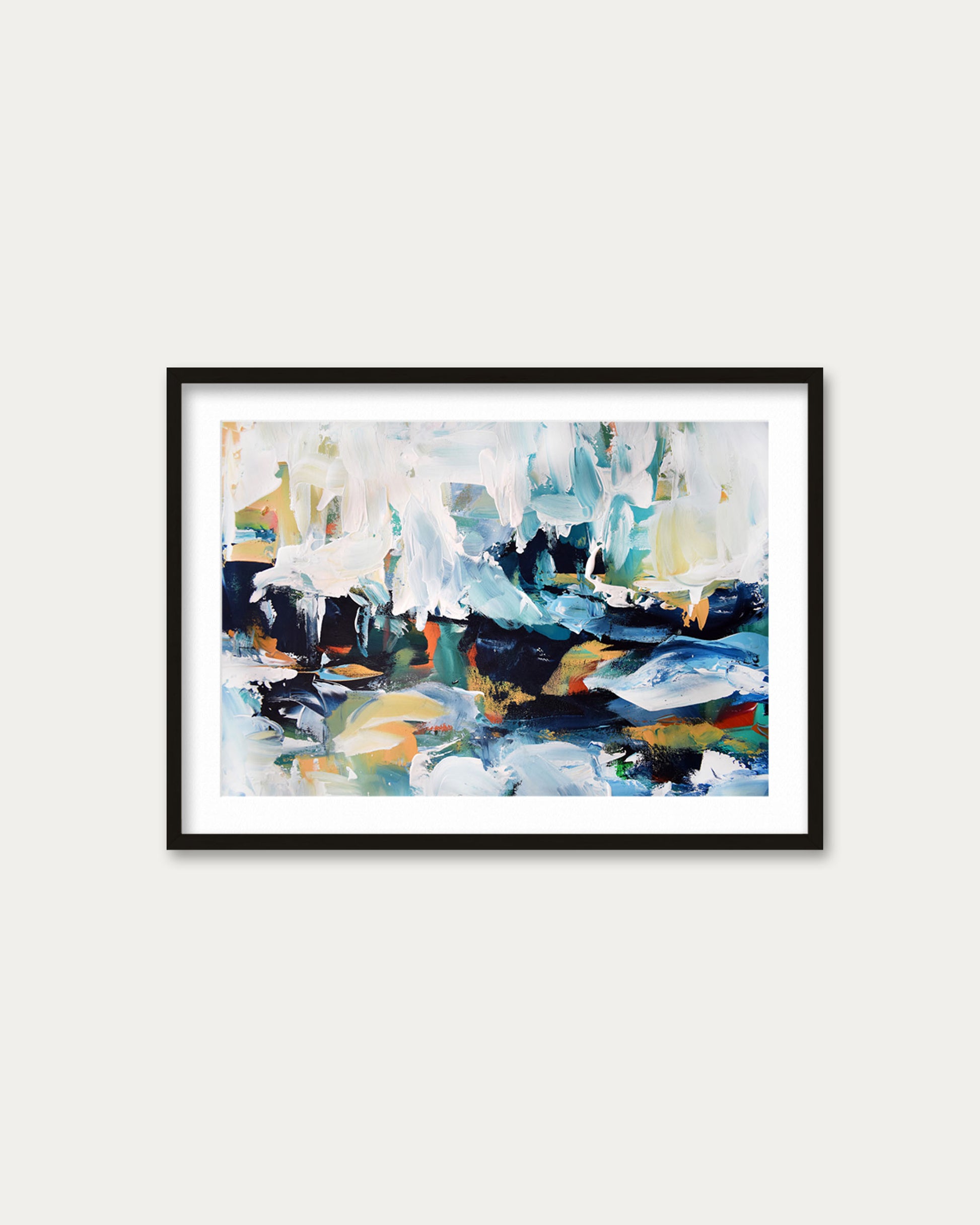 Framed abstract painting with colorful brushstrokes on a white wall