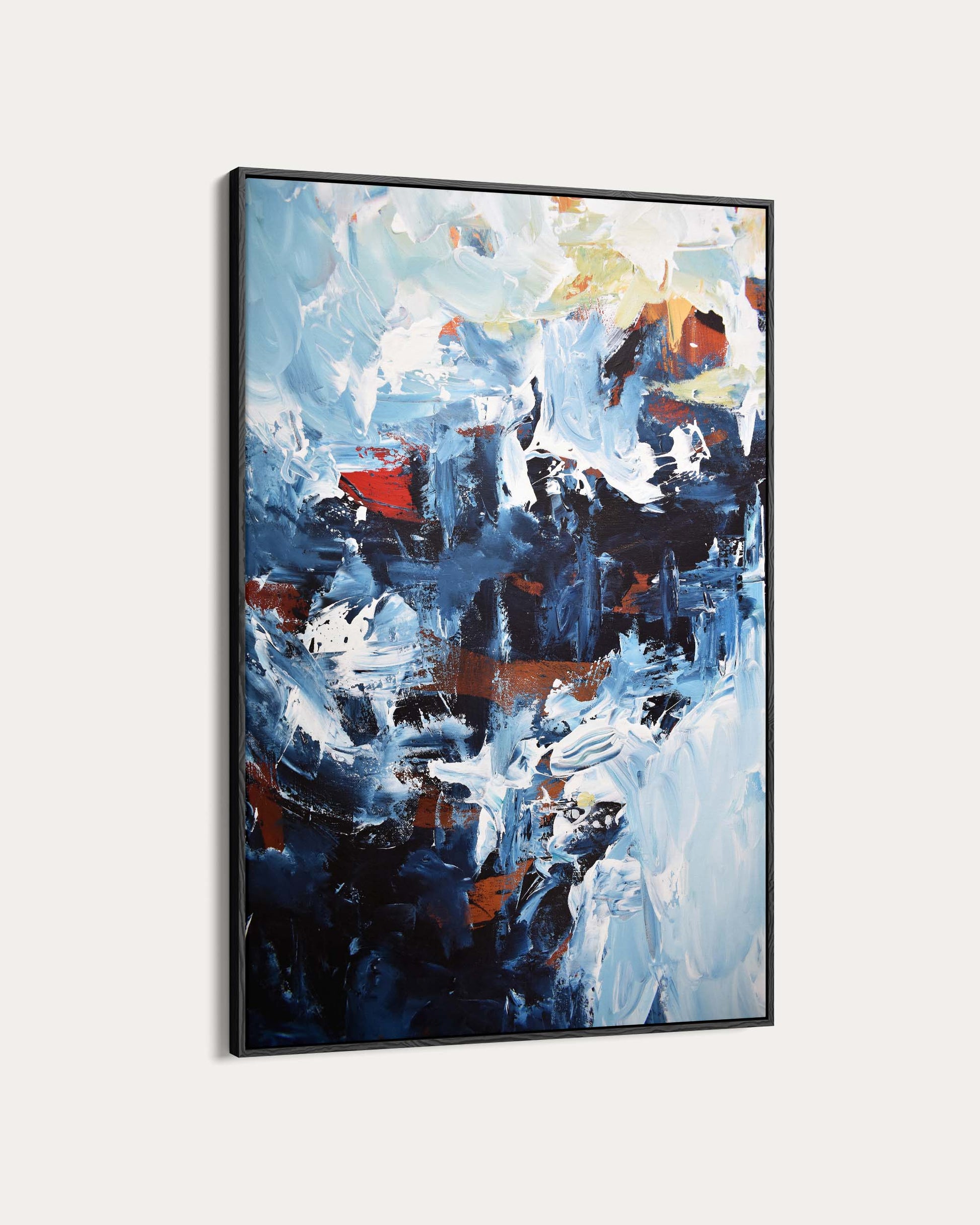 Framed abstract painting with a mix of blue, red, and white on a light gray background