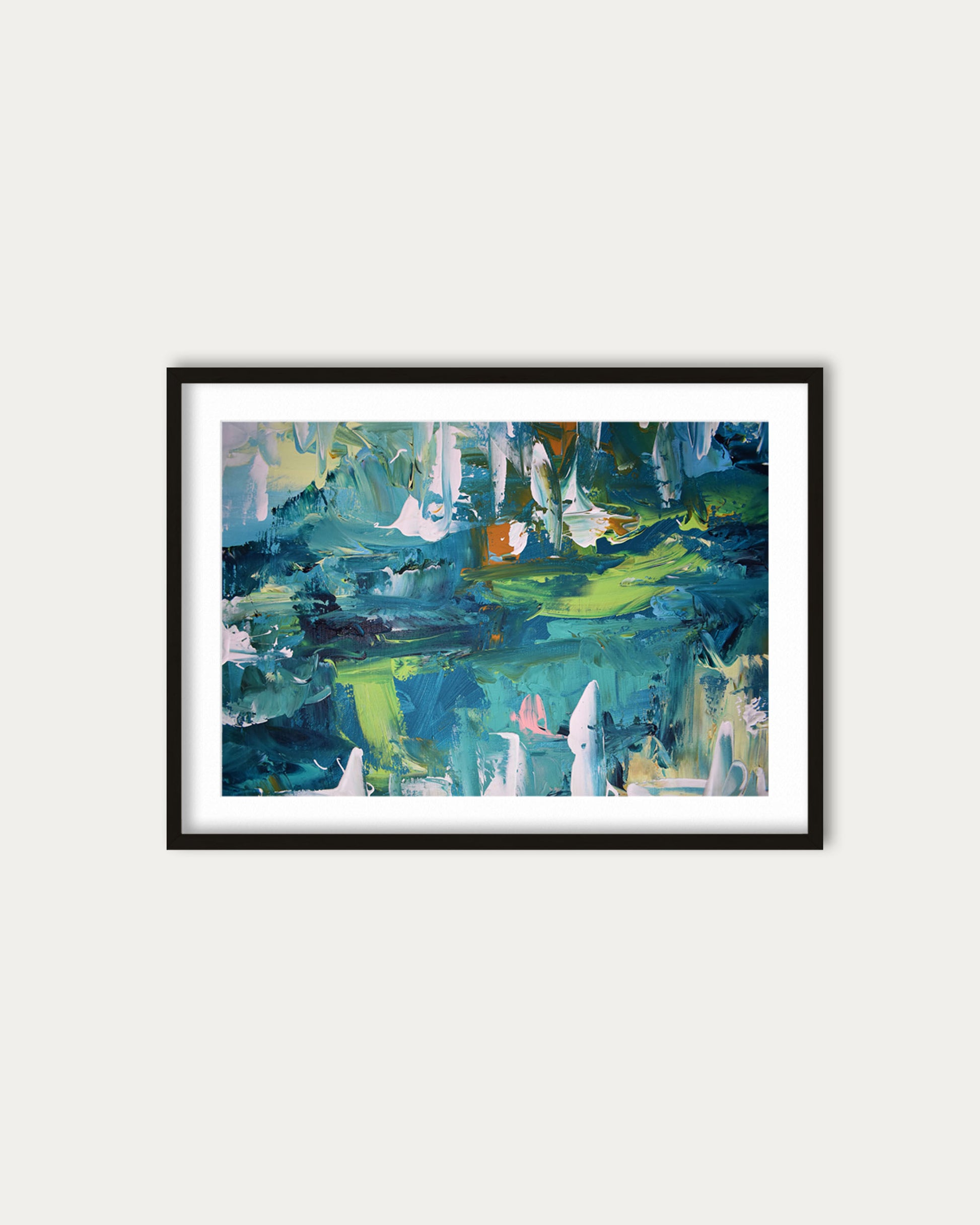 Framed abstract painting with blue and green tones on a white wall