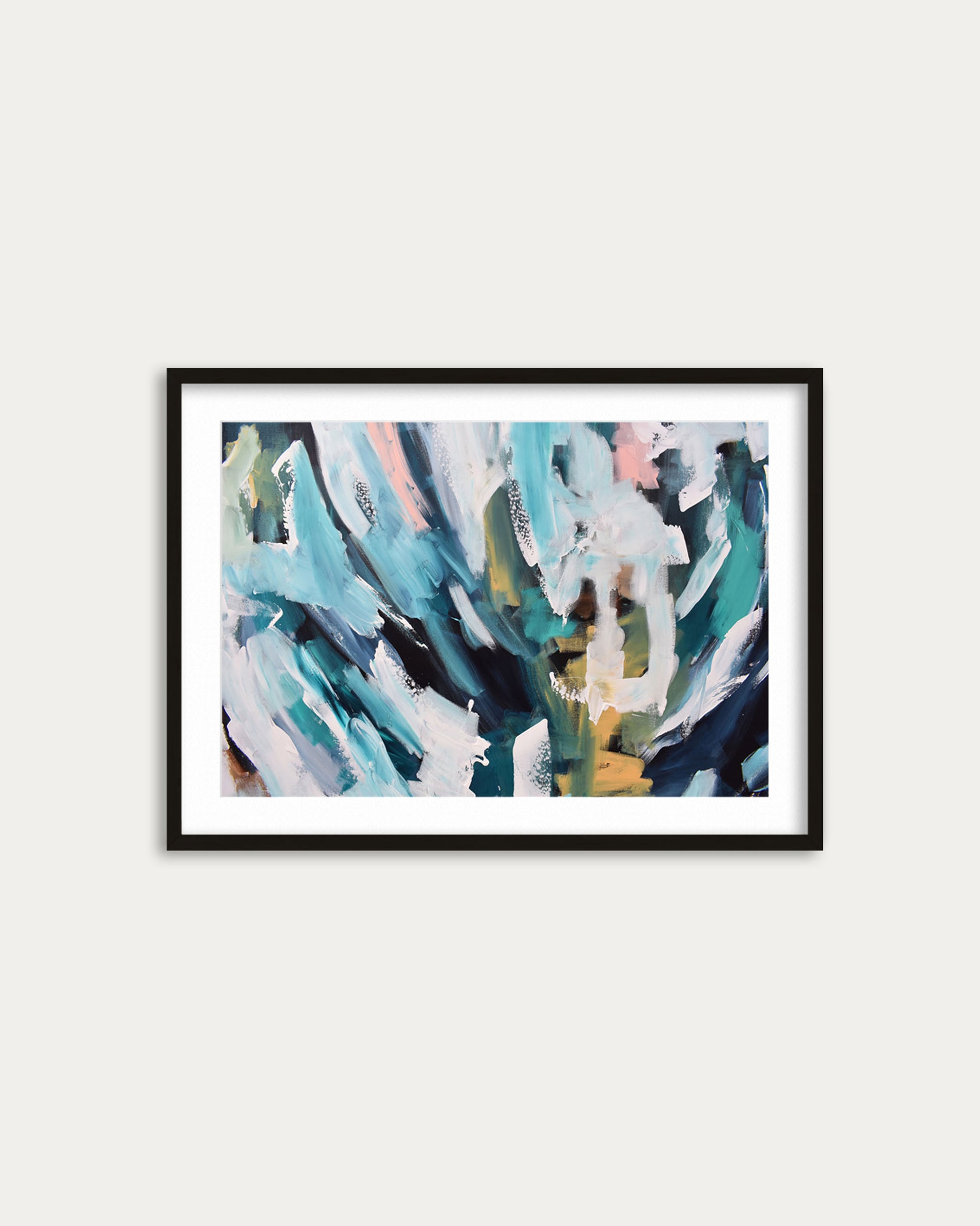 Framed abstract art print with colorful brush strokes on a white wall