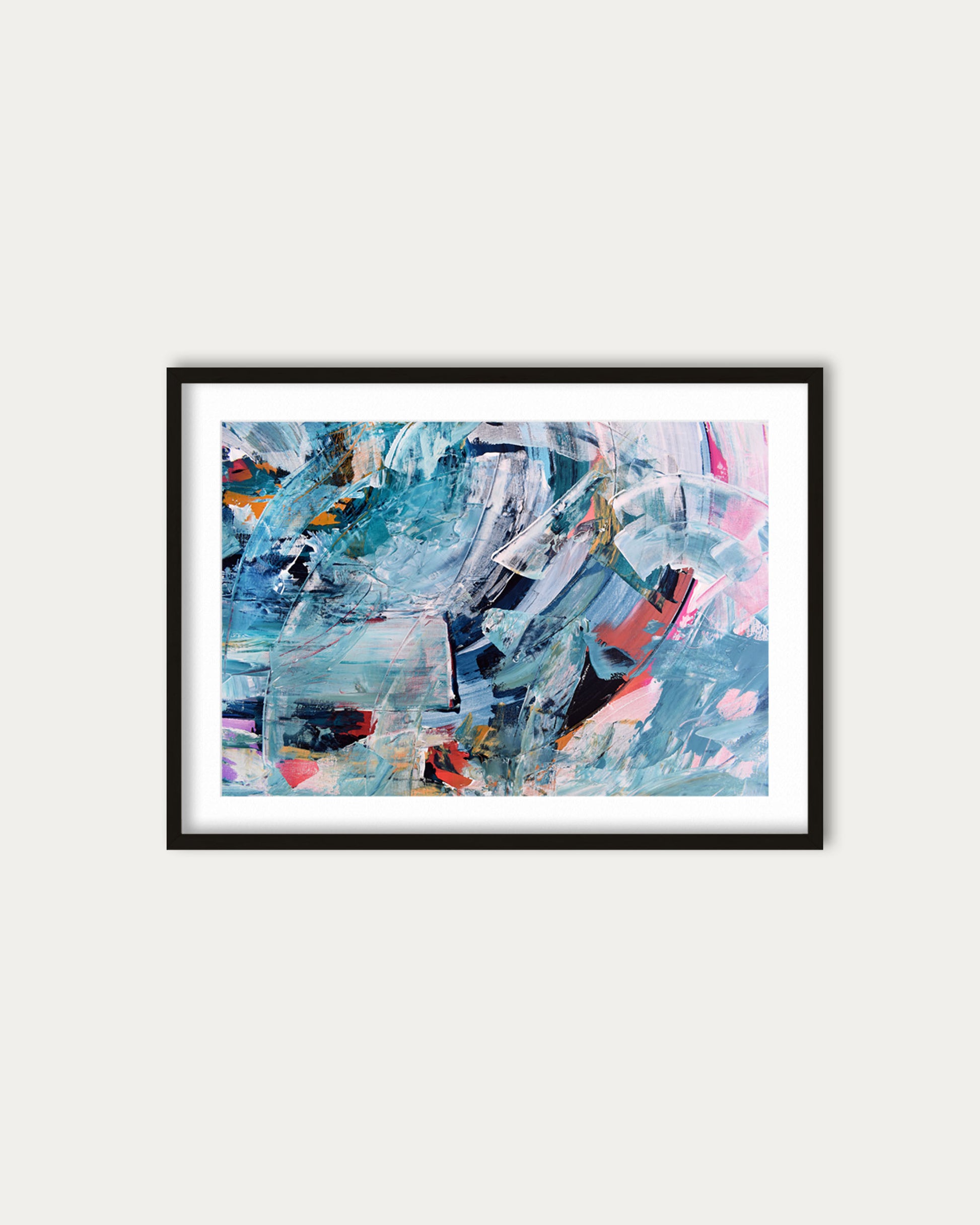 Framed abstract artwork with colorful patterns on a white wall
