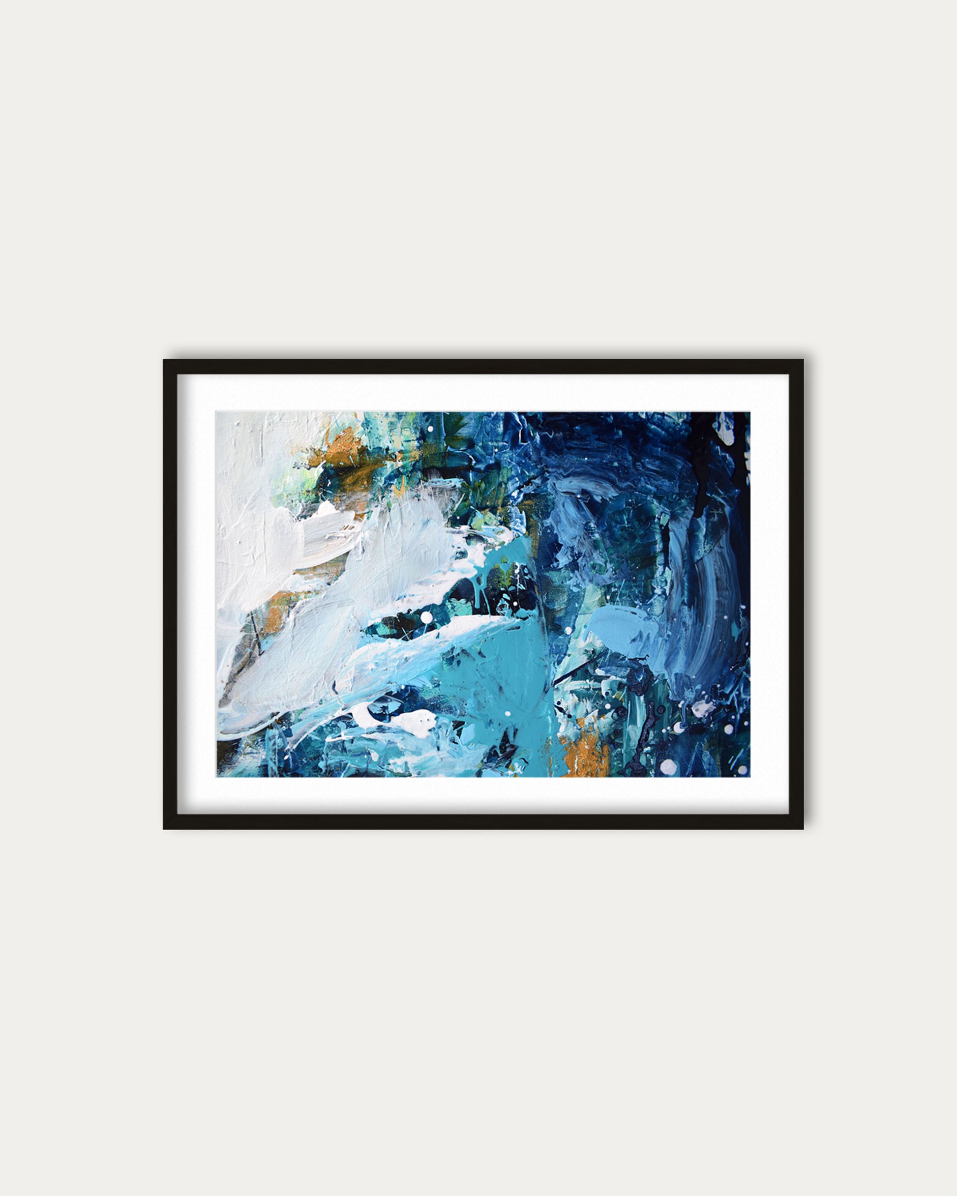 Framed abstract painting with blue and white tones on a light gray wall