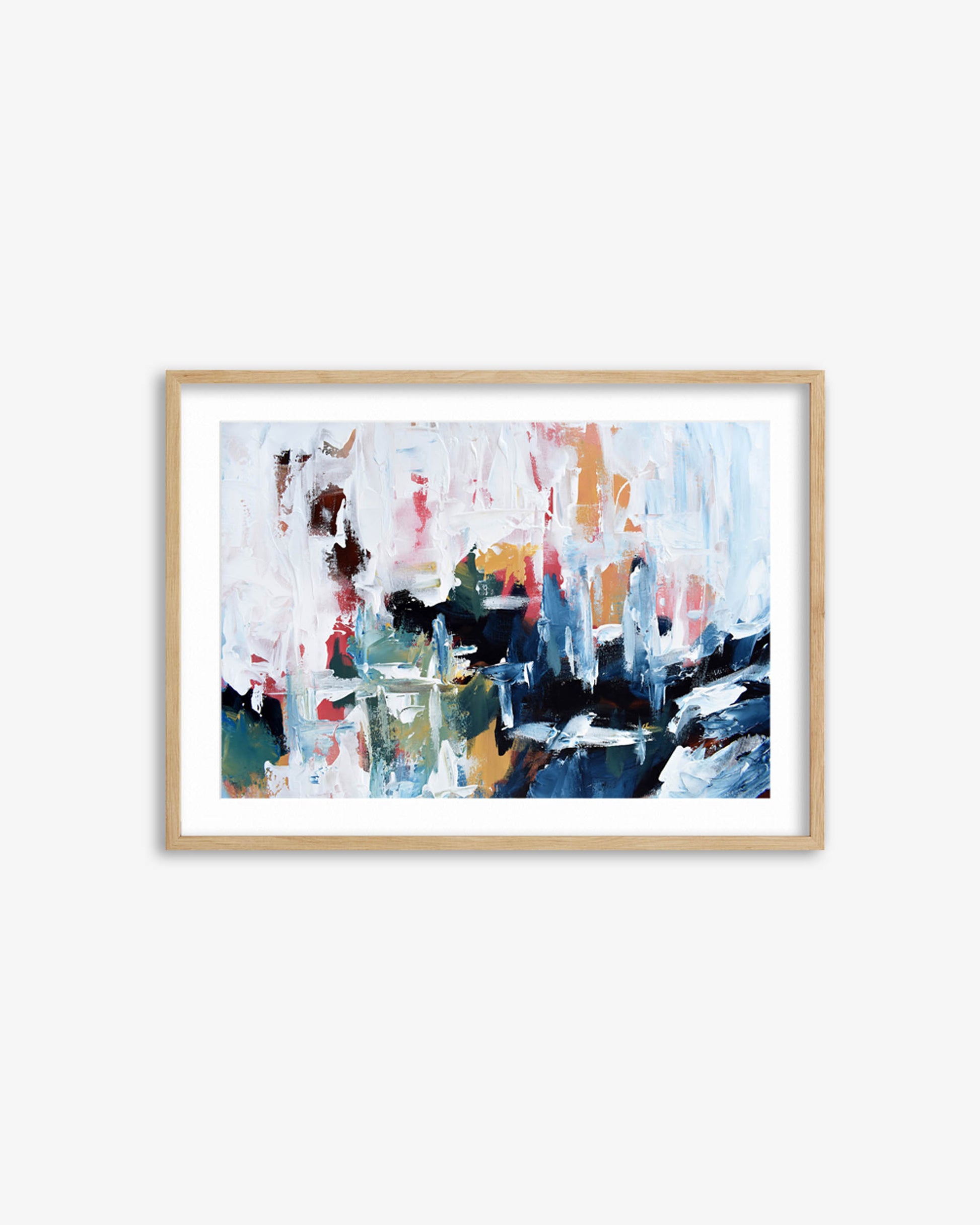 Framed abstract painting with colorful brush strokes on a white wall