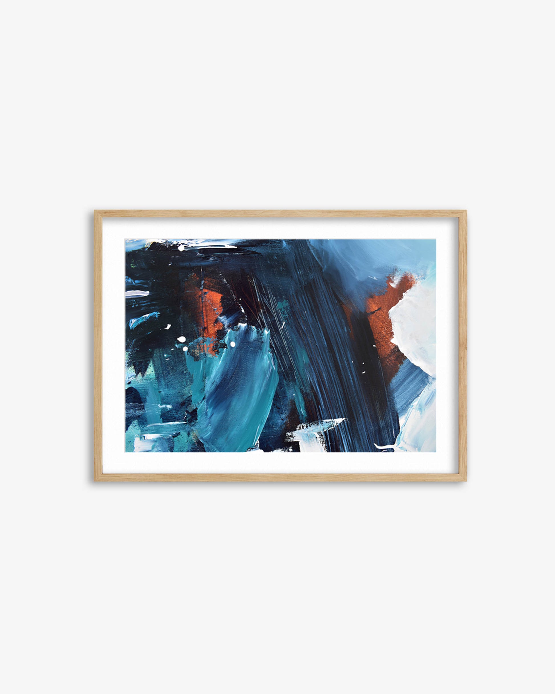 Framed abstract art print with blue and orange brushstrokes on a white wall