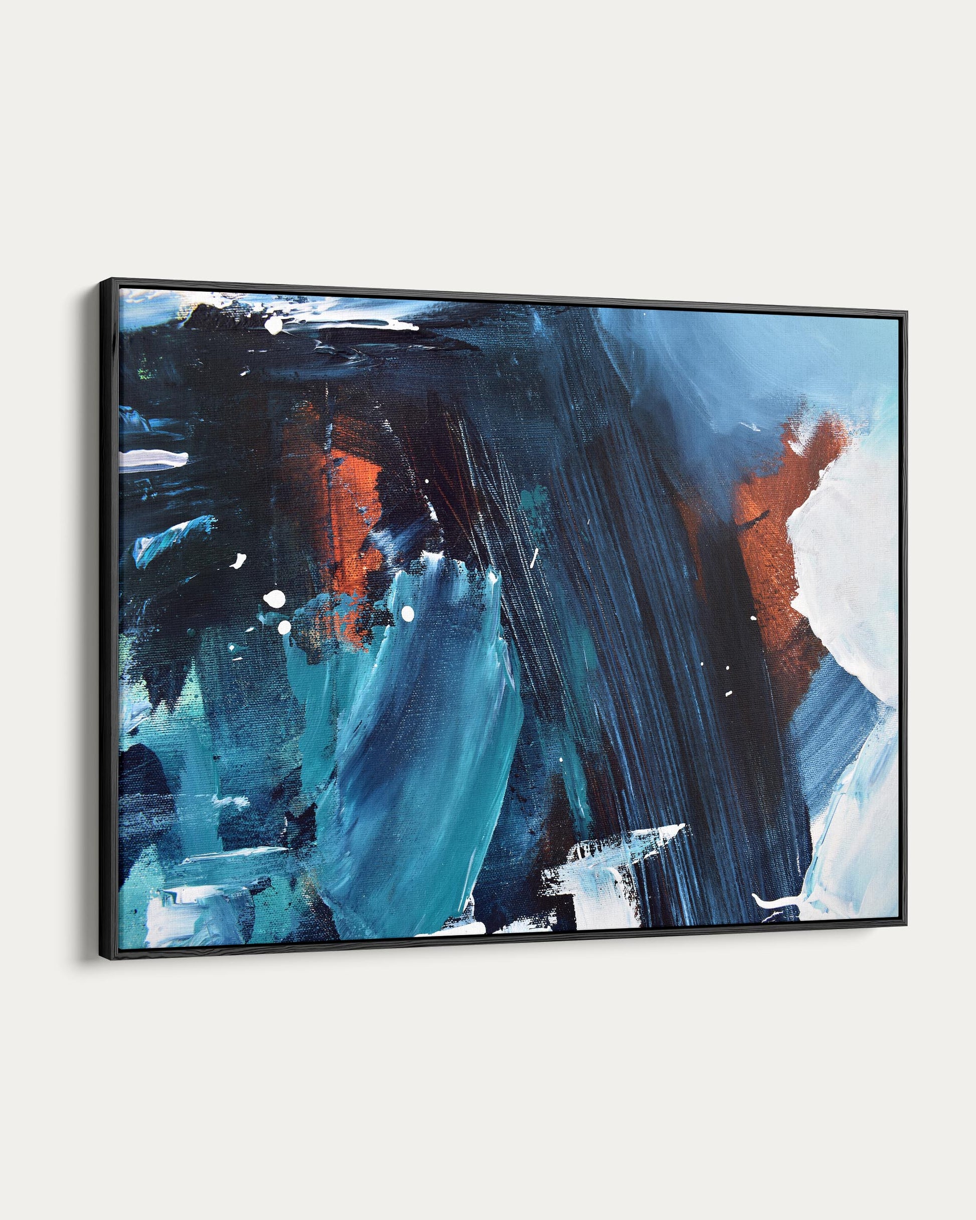 Abstract painting with blue, black, and orange strokes in a black frame on a white background