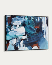 Abstract painting with blue, white, and black colors on a white wall.