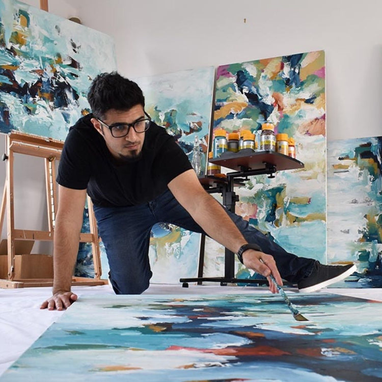 abstract artist Omar Obaid painting original art in his studio