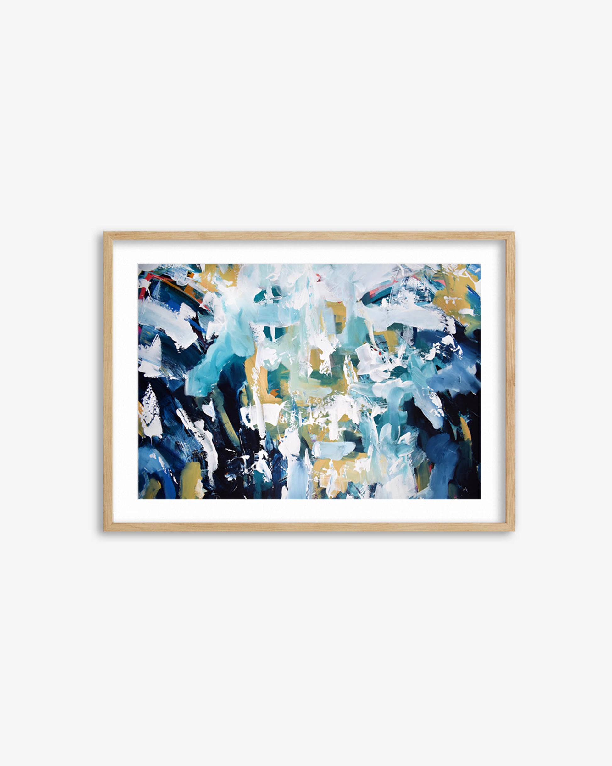 Framed abstract art print with blue, white, and gold colors on a white wall.