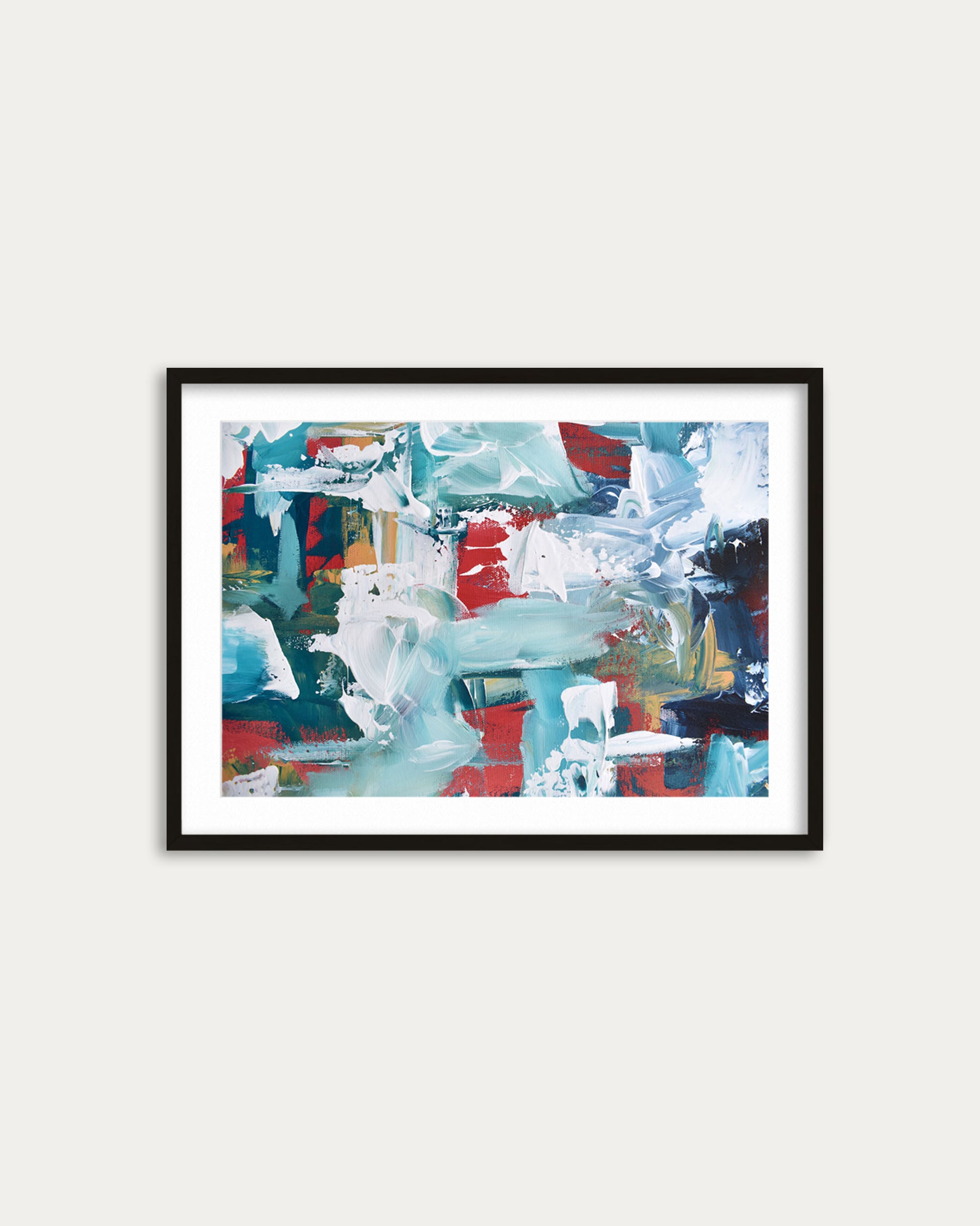 Framed abstract artwork with colorful brush strokes on a white wall
