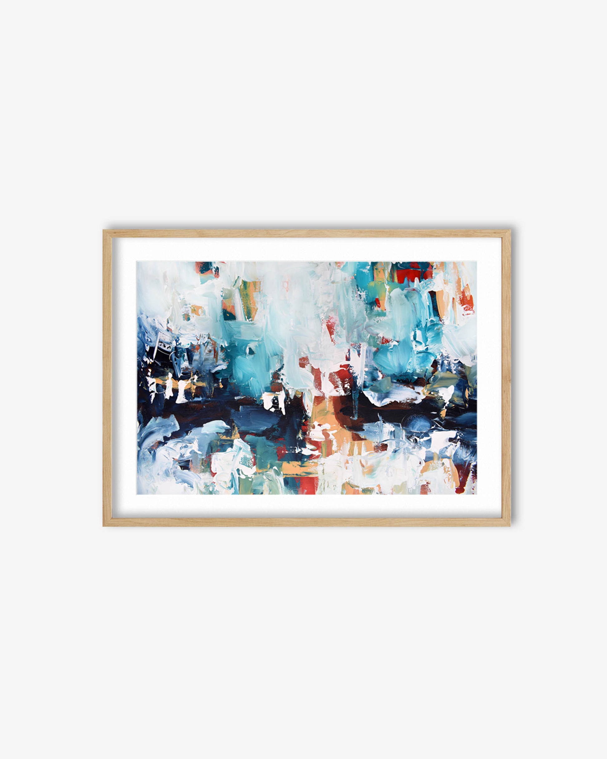Framed abstract artwork with blue, white, and red colors on a white wall.