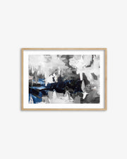 Framed abstract art print with black, white, and blue colors on a white background